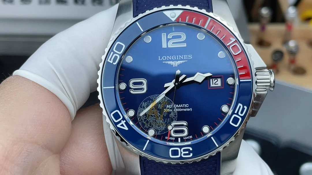 Longines Conquest Red Dial — photographed off the sweep