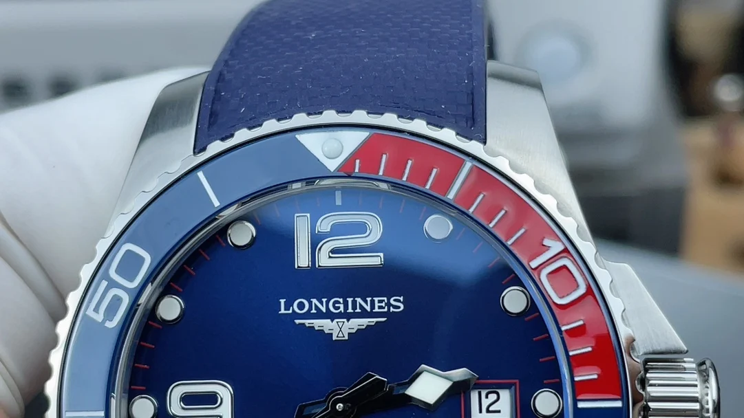 Longines Conquest Red Dial — photographed off the sweep
