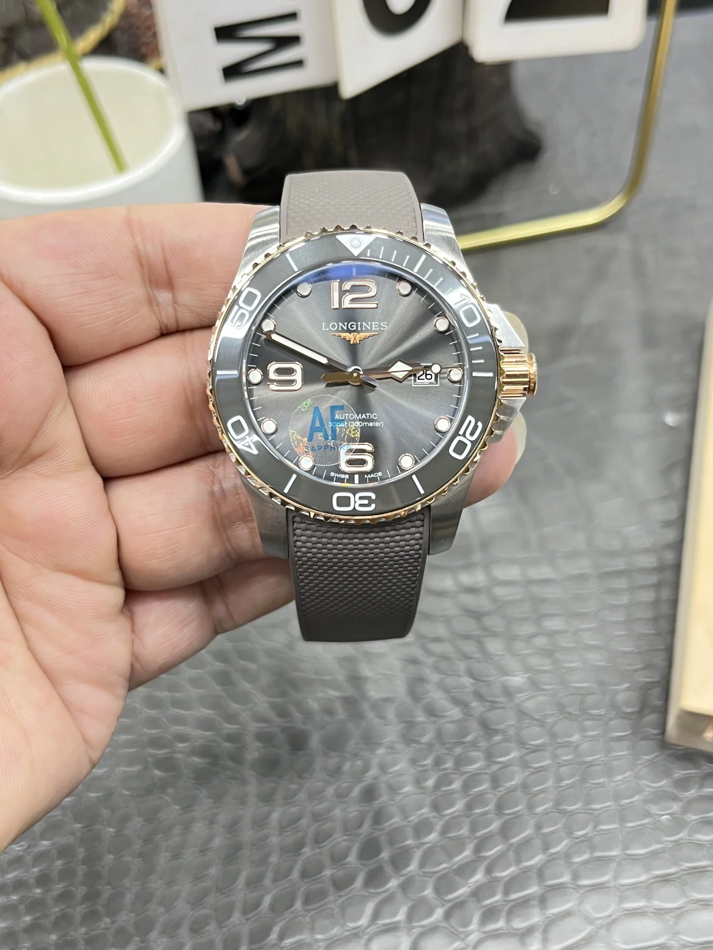 Longines Conquest Rose Gold Grey Dial — photographed off the sweep