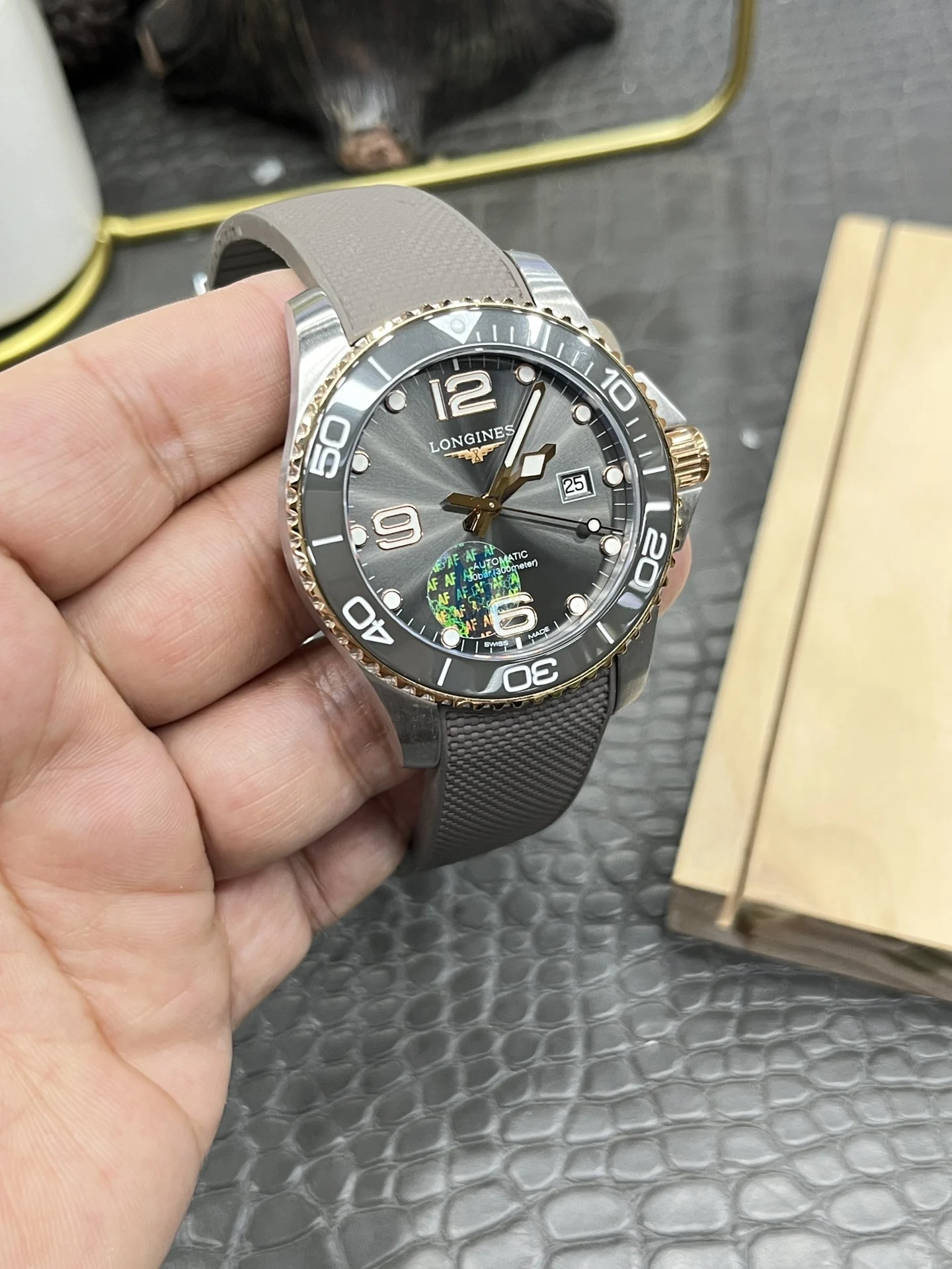 Longines Conquest Rose Gold Grey Dial — photographed off the sweep