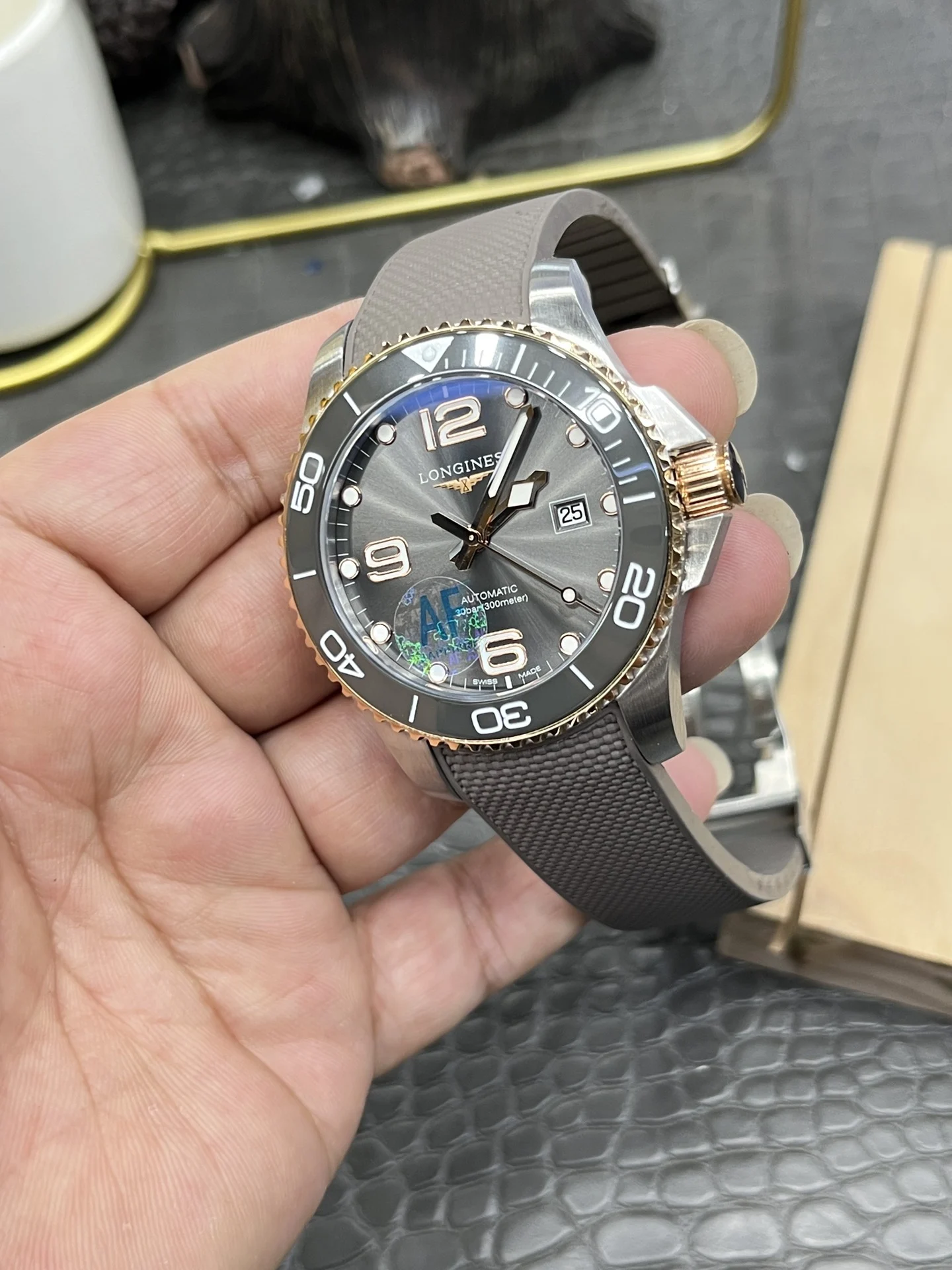 Longines Conquest Rose Gold Grey Dial — photographed off the sweep