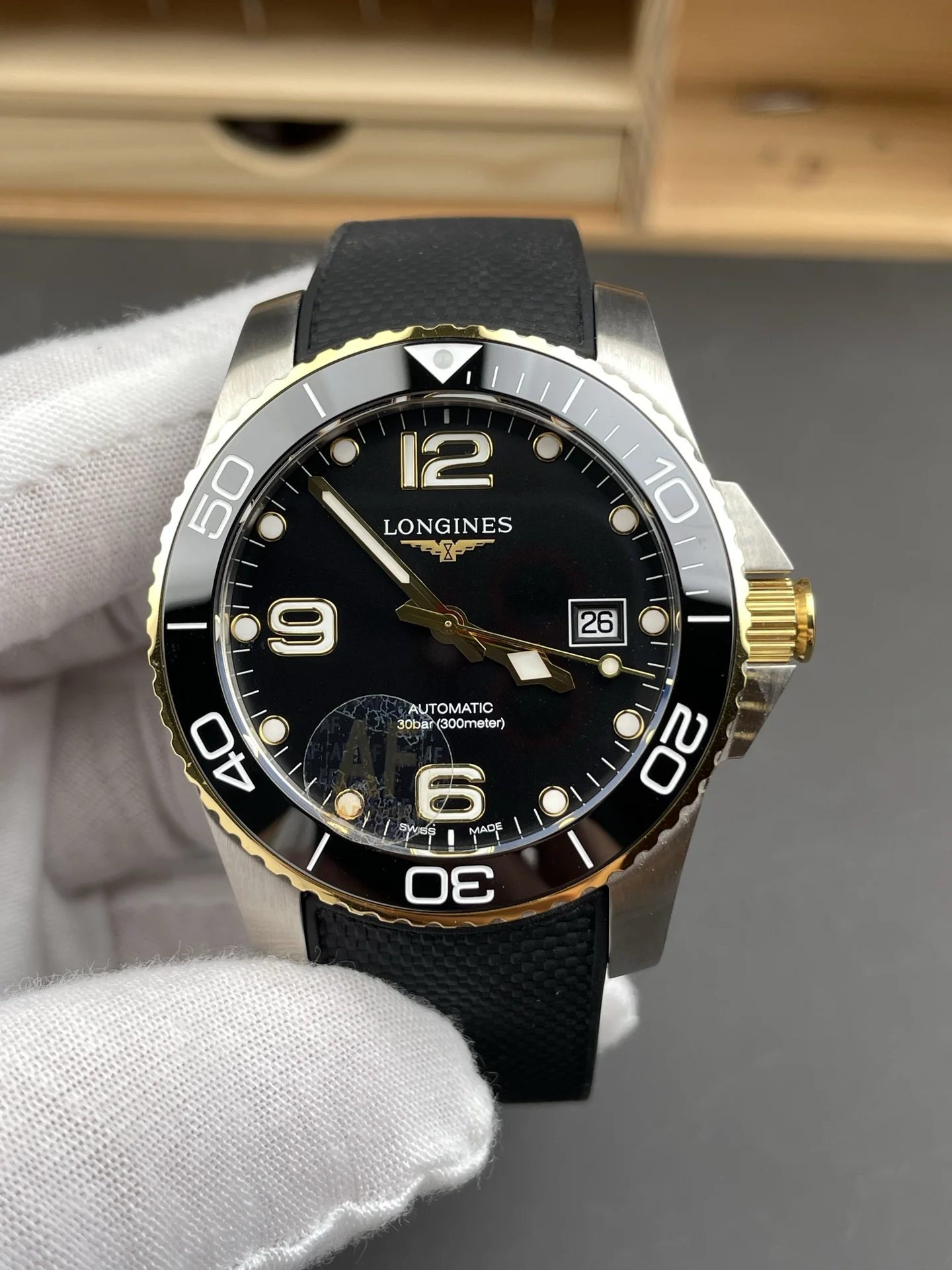 Longines Conquest Two-Tone Black Dial 41mm — photographed off the sweep