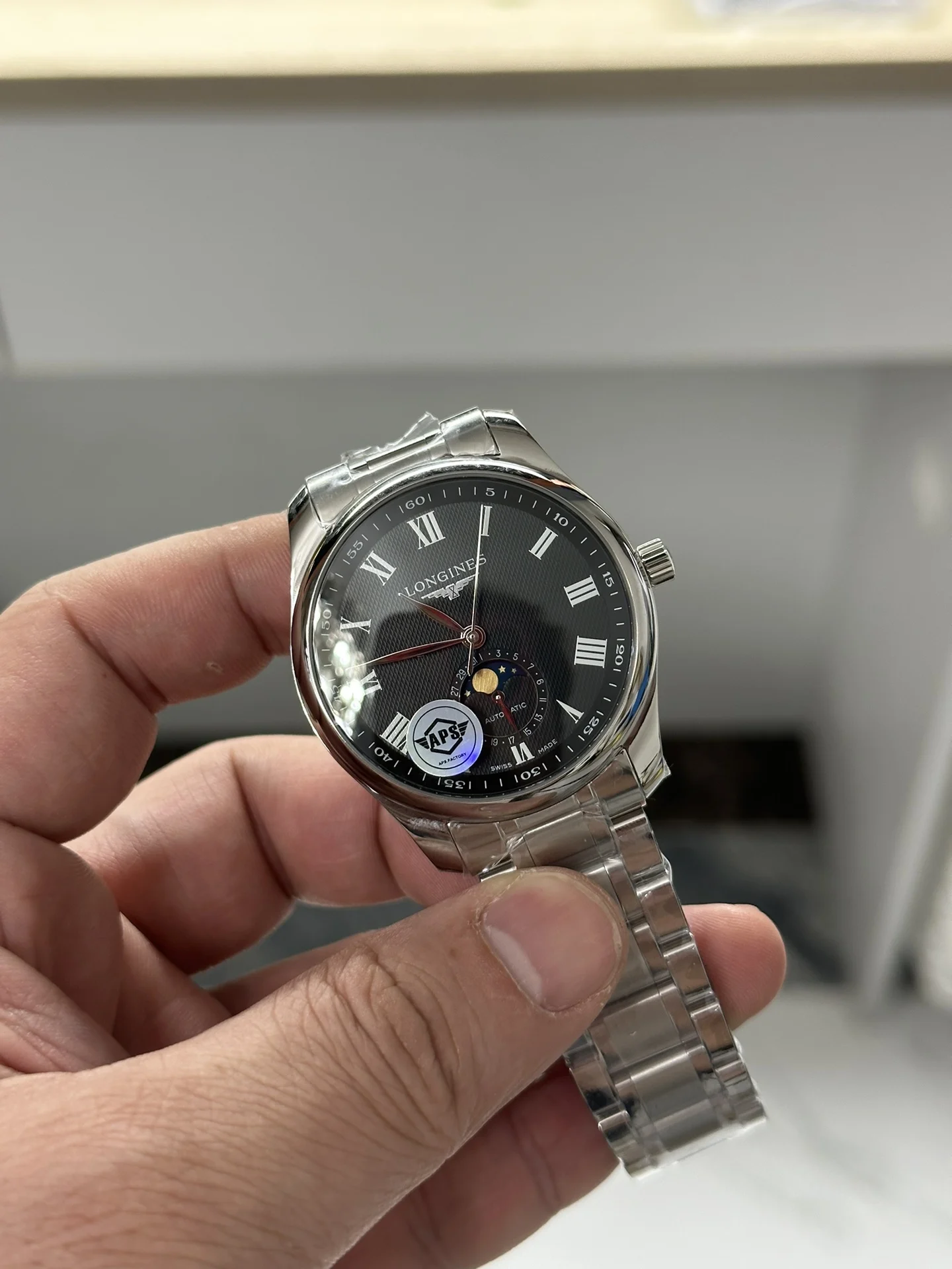 Longines Moon Phase Black Dial — photographed off the sweep