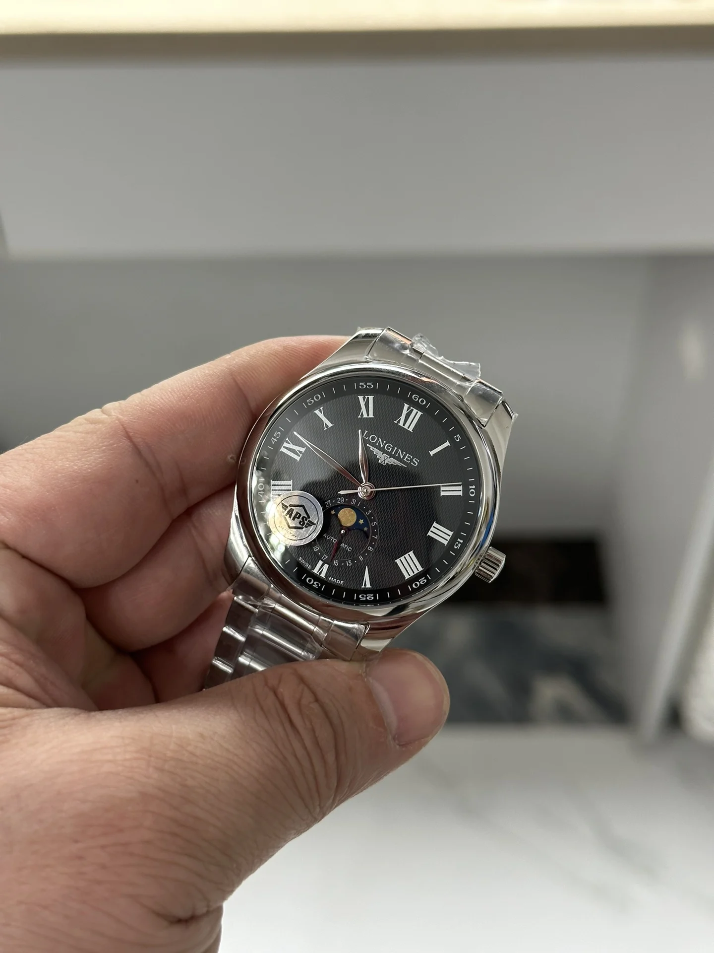 Longines Moon Phase Black Dial — photographed off the sweep