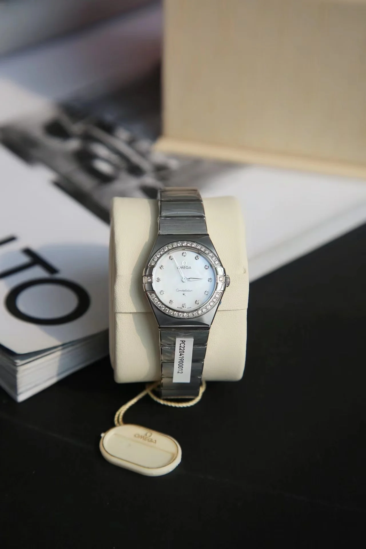 Omega Constellation Red Dial Diamond-Set 28mm — photographed off the sweep