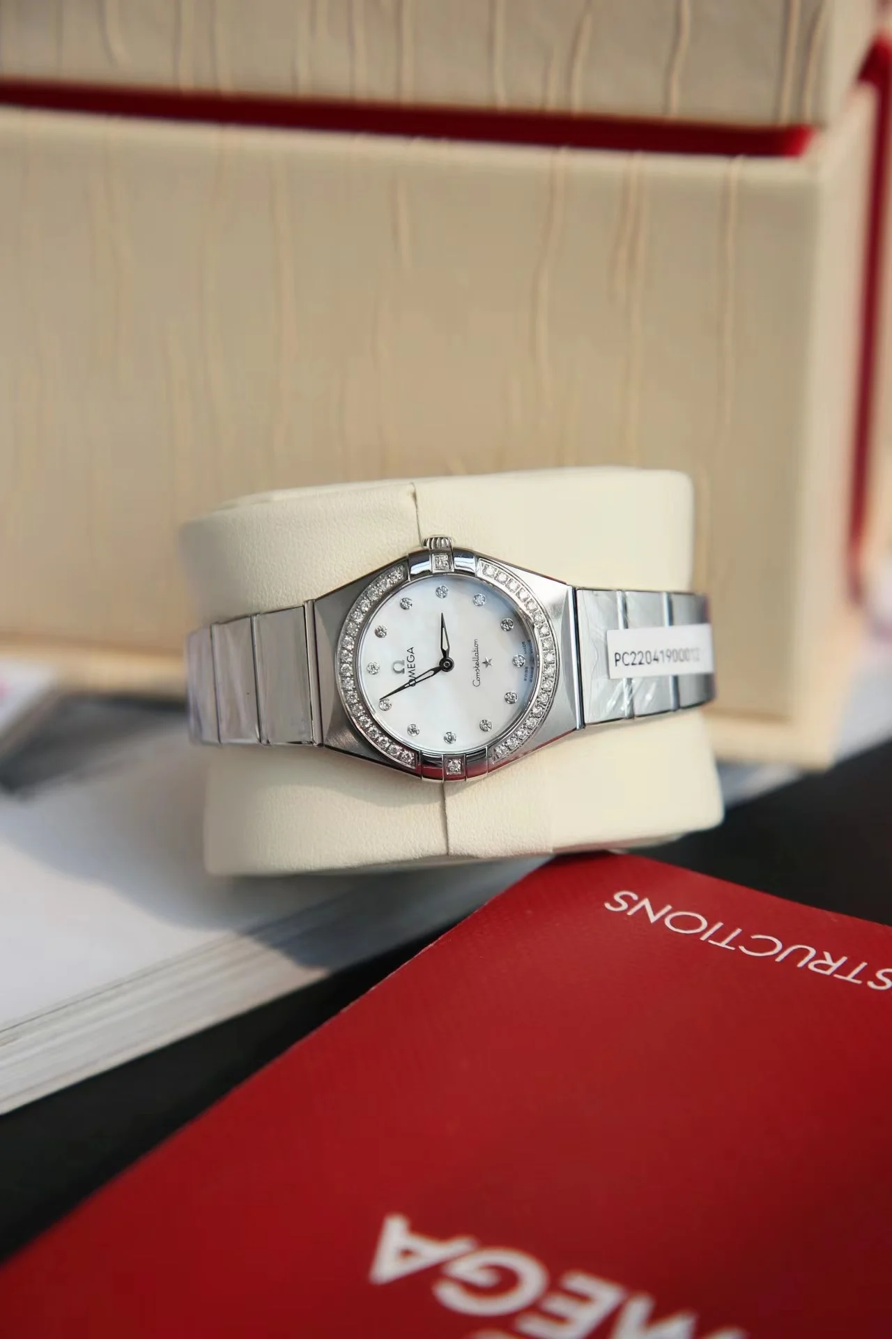 Omega Constellation Red Dial Diamond-Set 28mm — photographed off the sweep