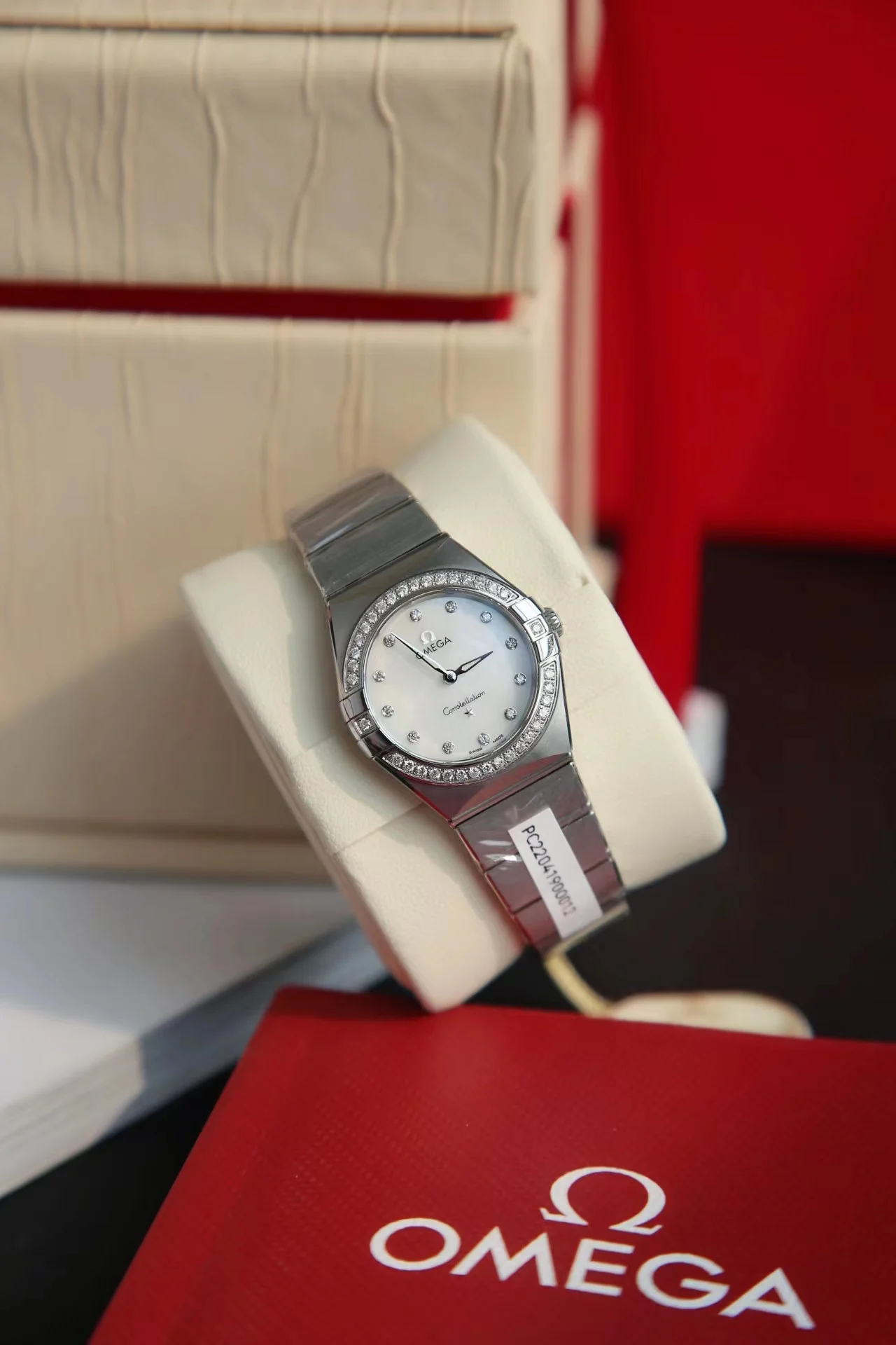 Omega Constellation Red Dial Diamond-Set 28mm — photographed off the sweep