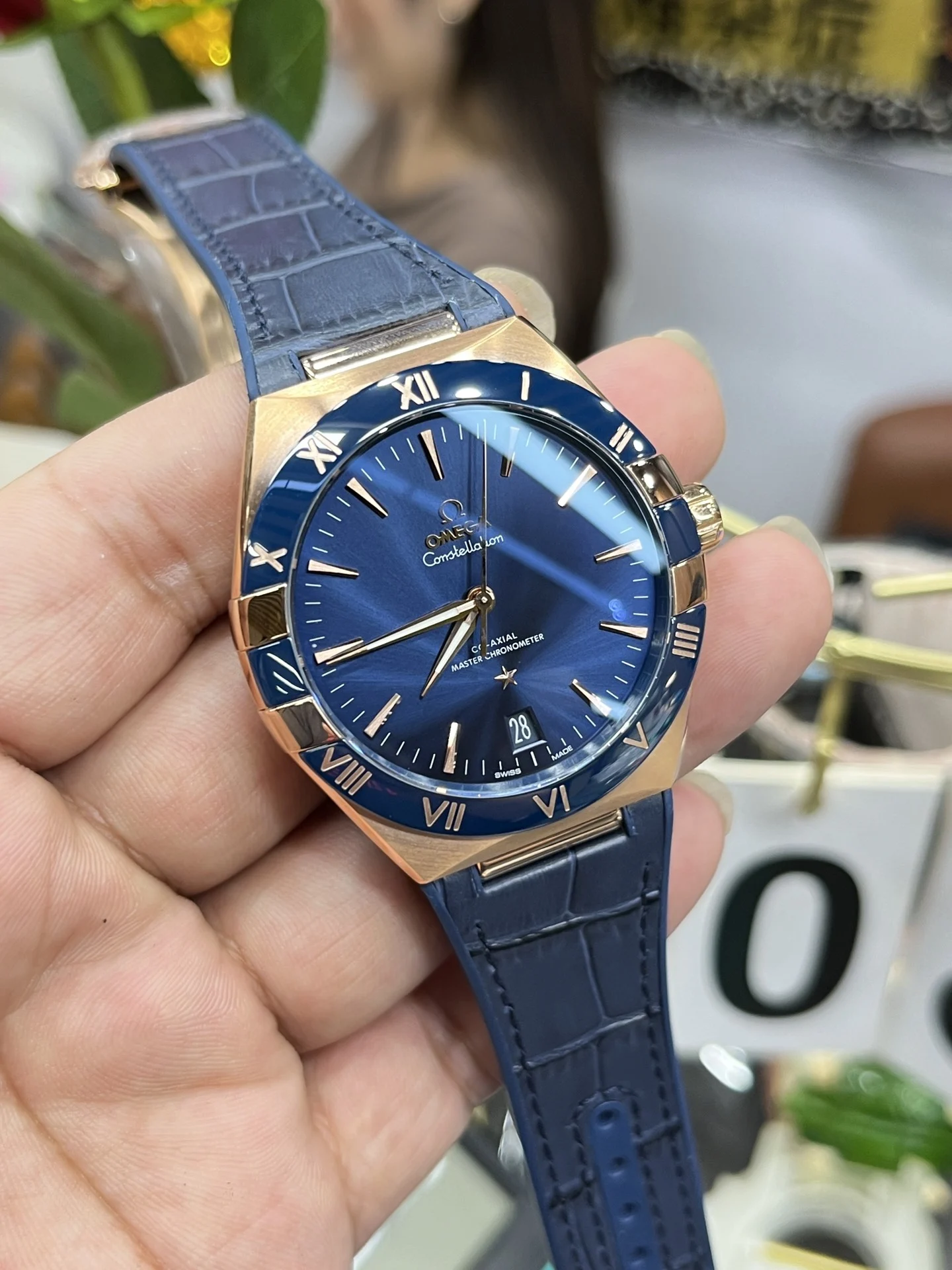 Omega Constellation Rose Gold Blue Dial 41mm — photographed off the sweep