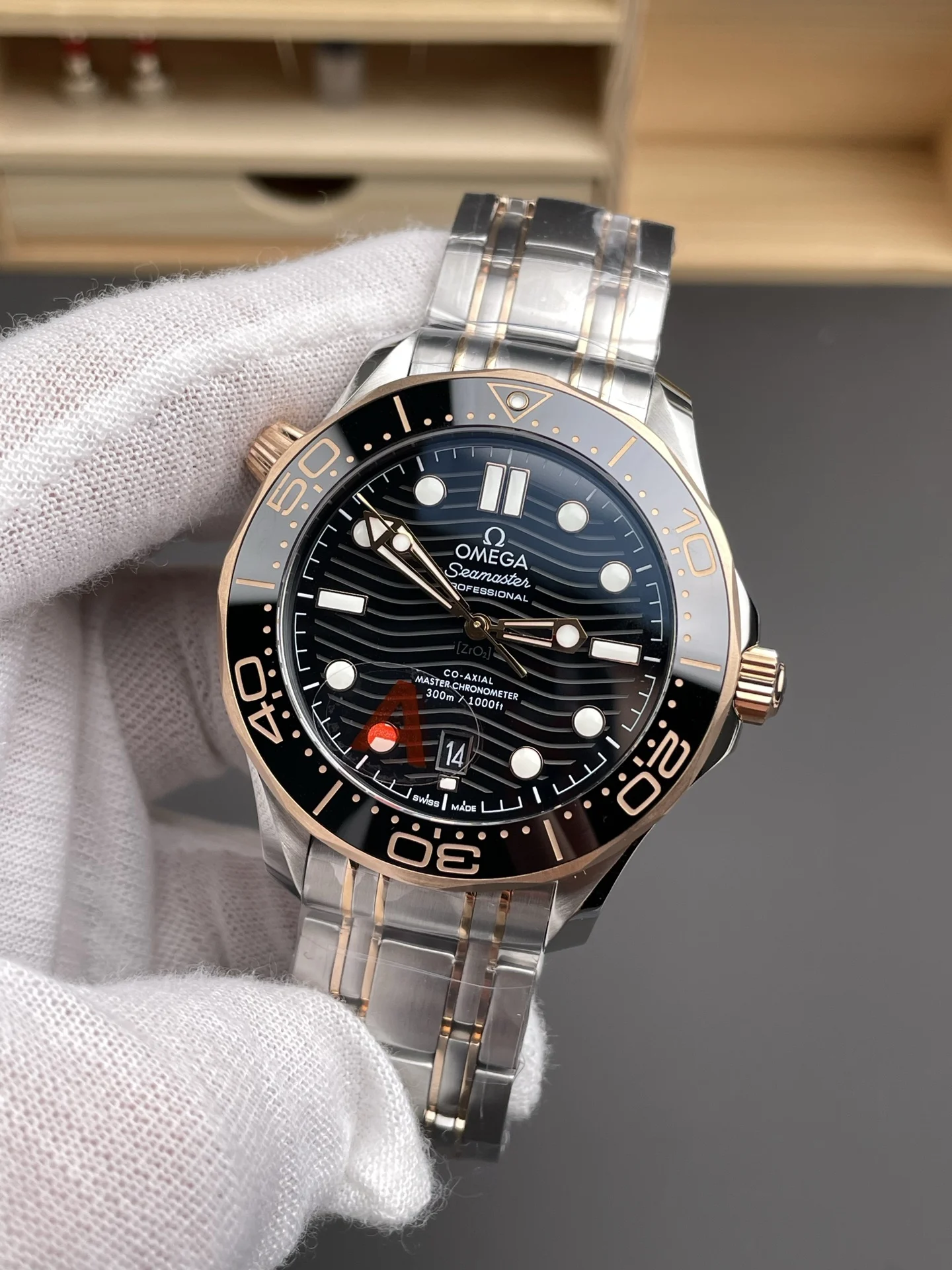 Omega Seamaster 300 Rose Gold Black Dial 42mm — photographed off the sweep