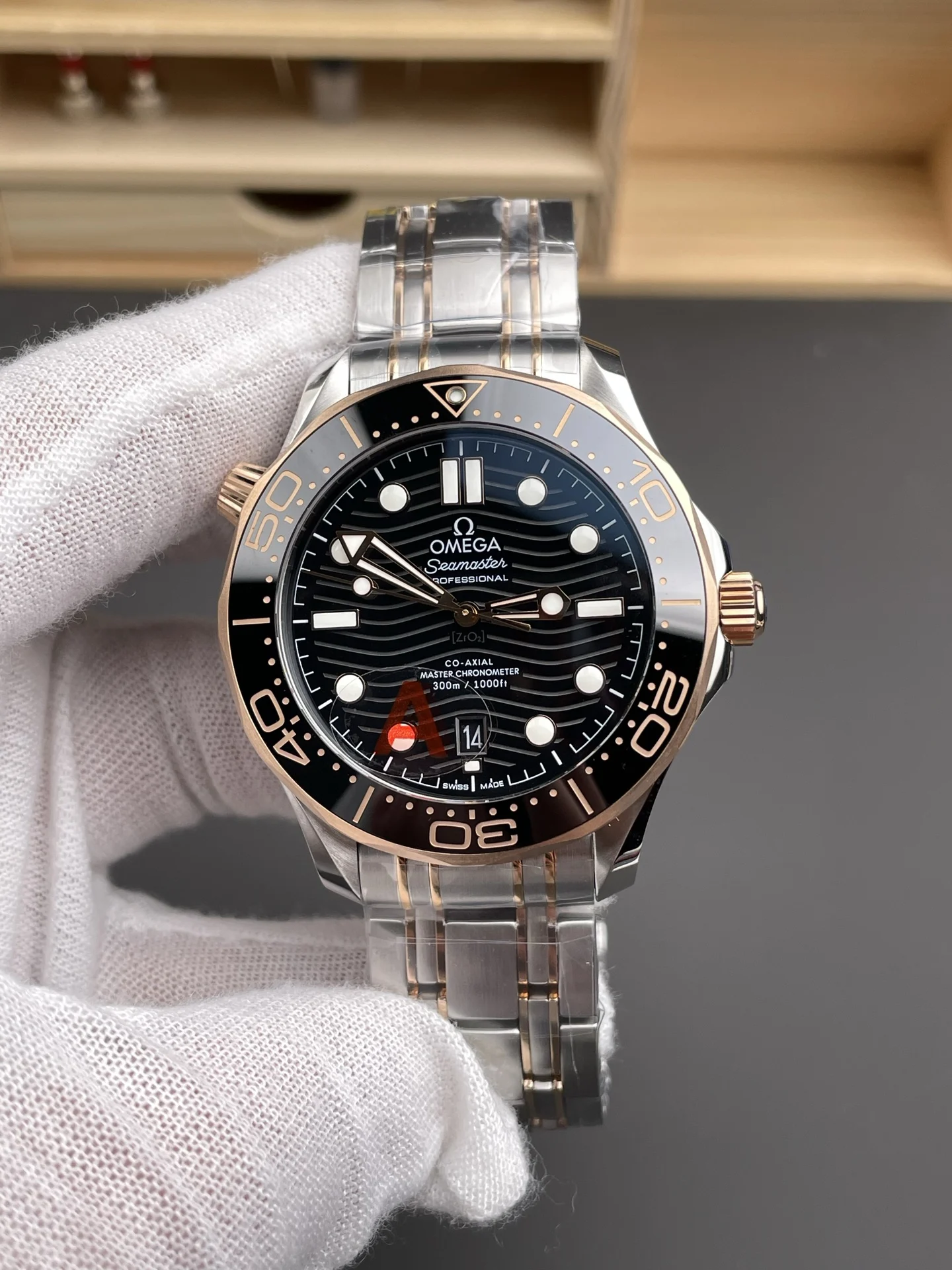Omega Seamaster 300 Rose Gold Black Dial 42mm — photographed off the sweep