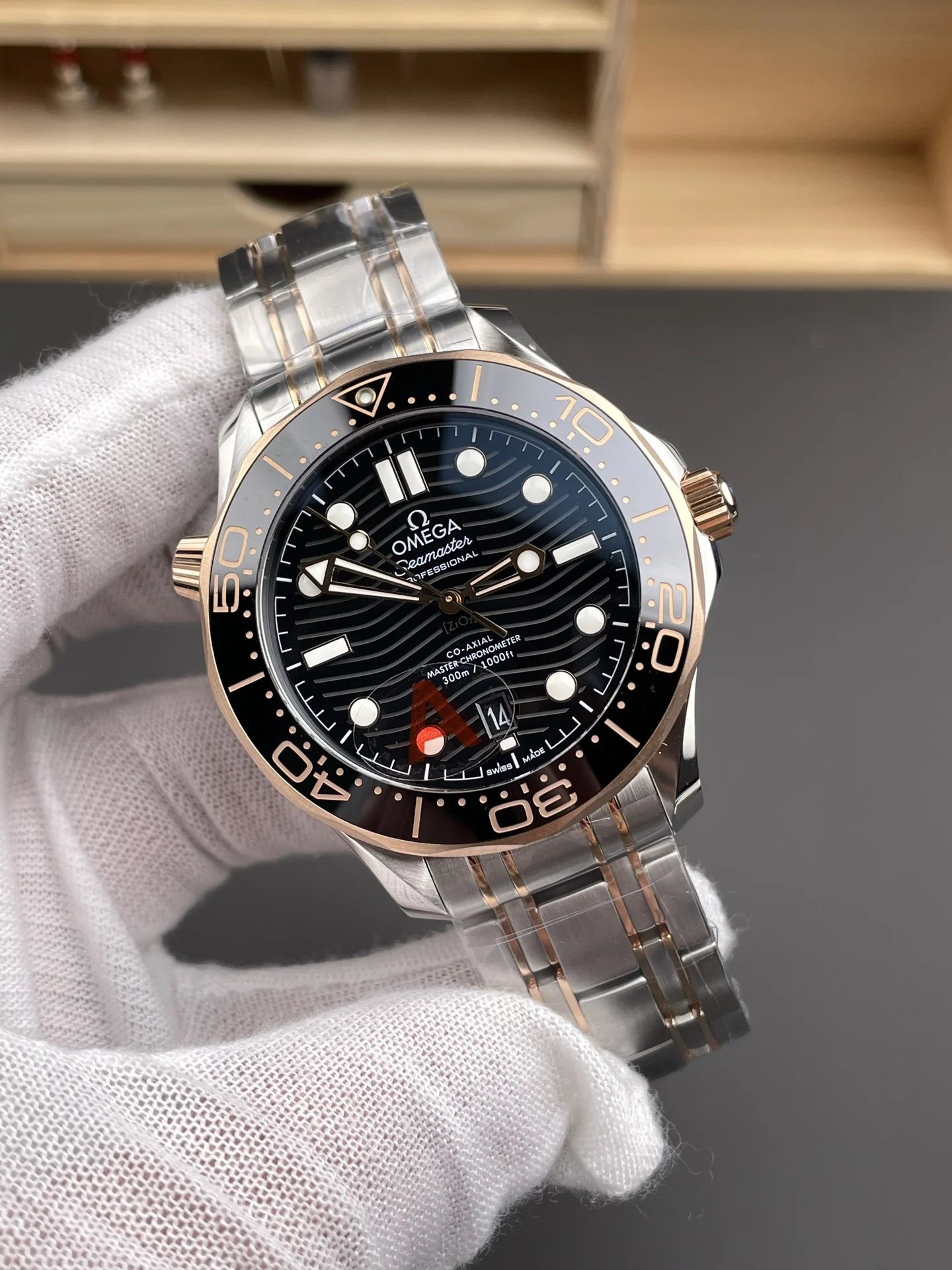 Omega Seamaster 300 Rose Gold Black Dial 42mm — photographed off the sweep