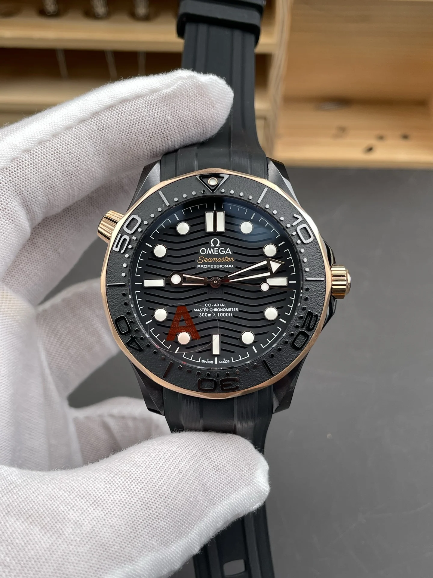 Omega Seamaster 300 Rose Gold Black Dial 42mm — photographed off the sweep