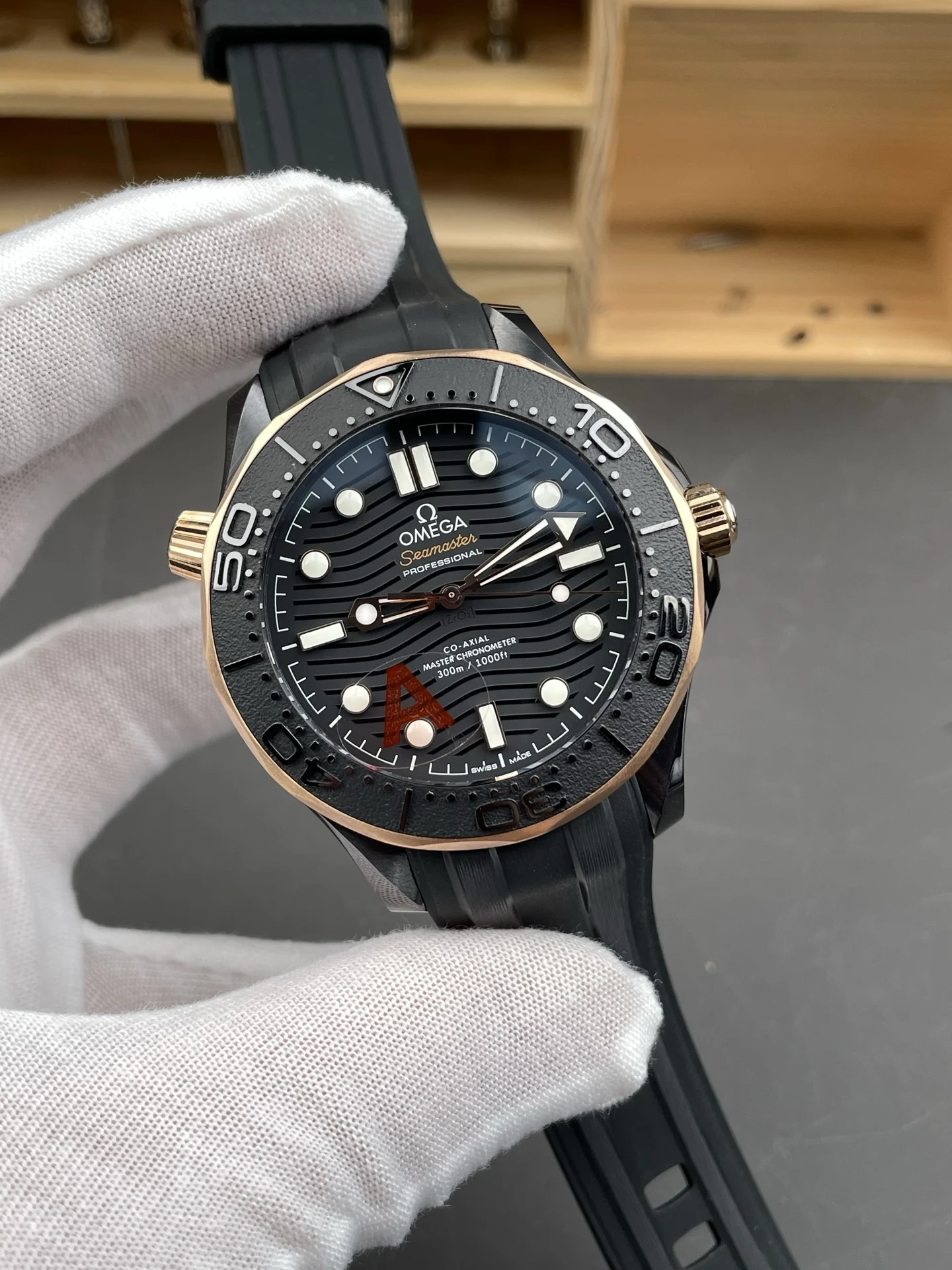 Omega Seamaster 300 Rose Gold Black Dial 42mm — photographed off the sweep