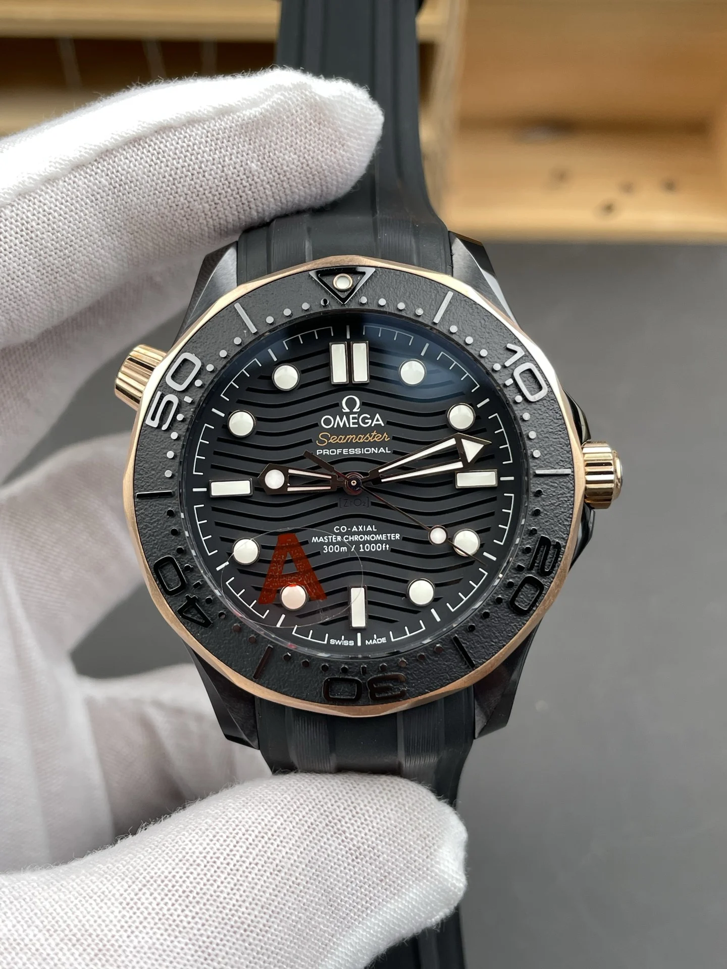 Omega Seamaster 300 Rose Gold Black Dial 42mm — photographed off the sweep