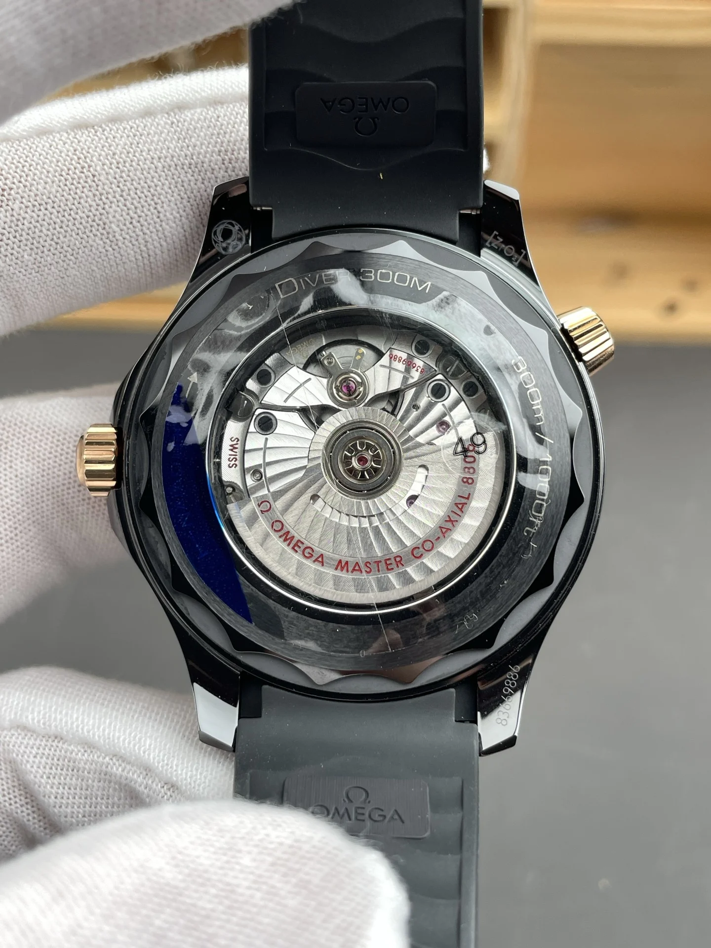 Omega Seamaster 300 Rose Gold Black Dial 42mm — photographed off the sweep
