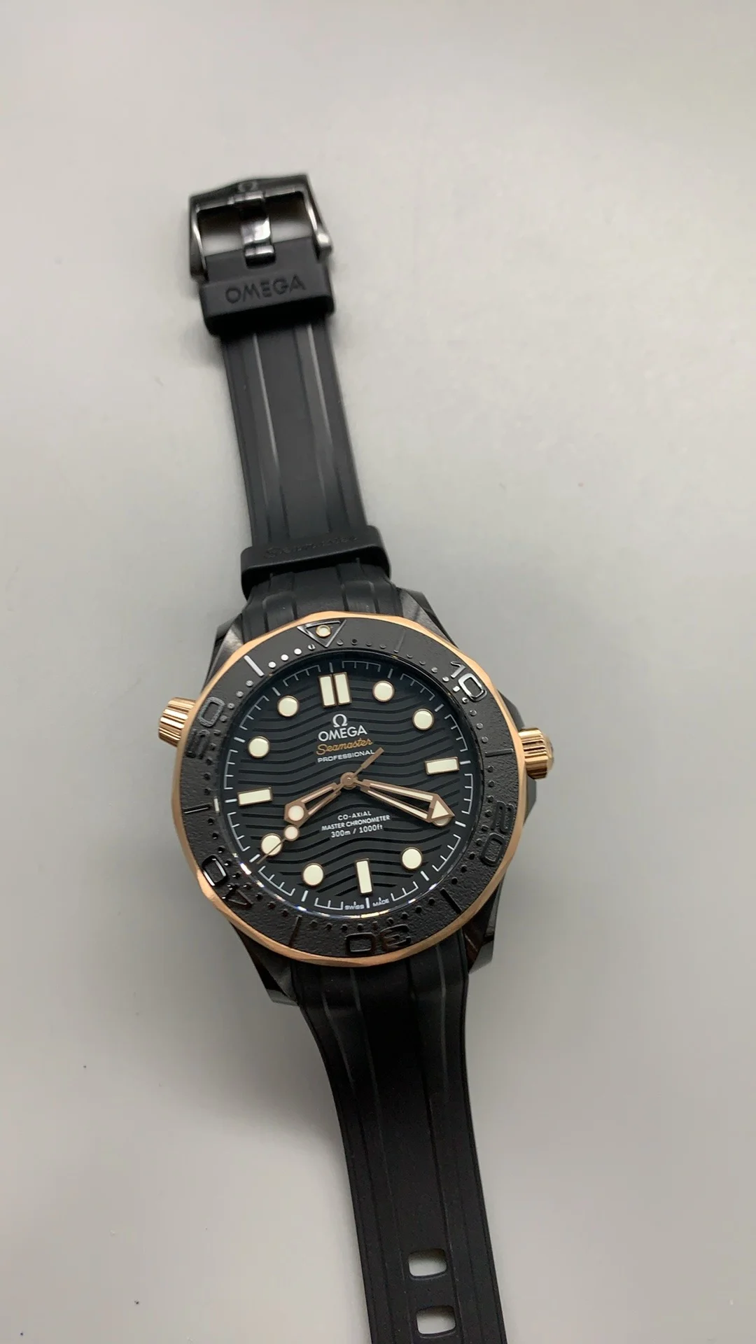 Omega Seamaster 300 Rose Gold Black Dial 43.5mm — photographed off the sweep