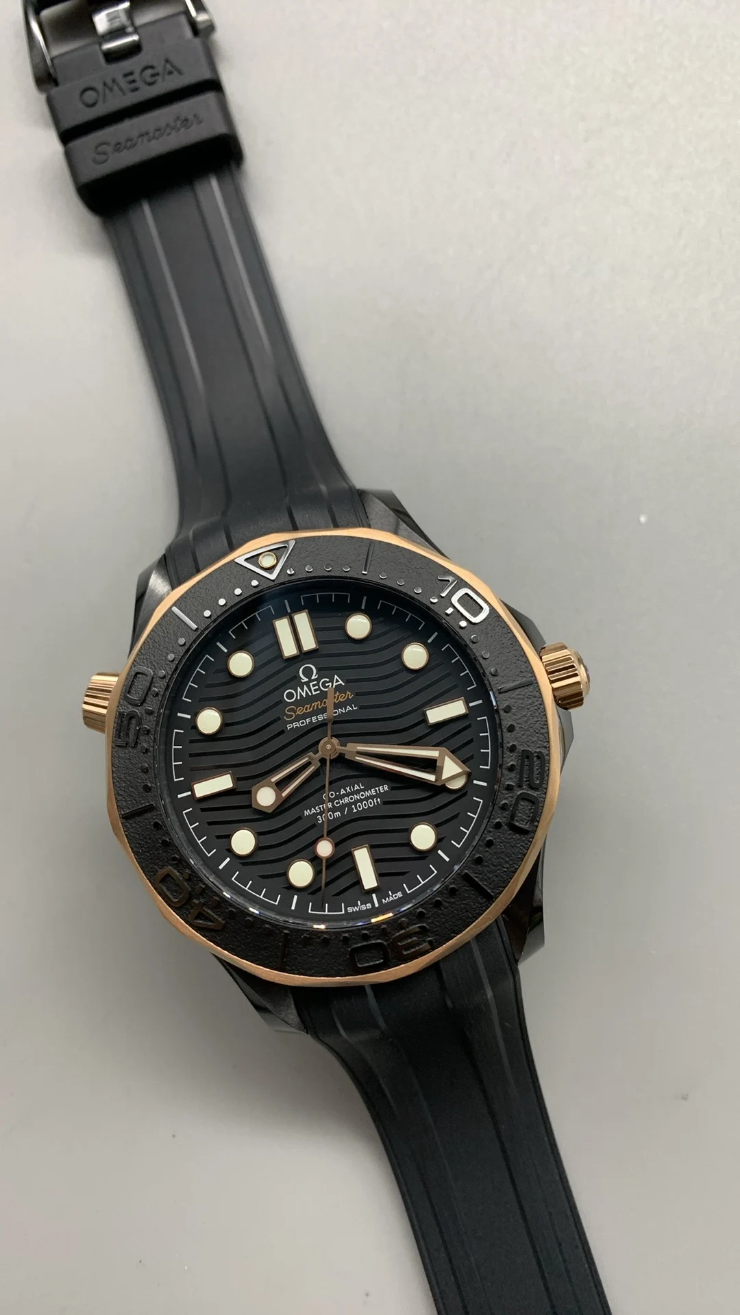 Omega Seamaster 300 Rose Gold Black Dial — photographed off the sweep