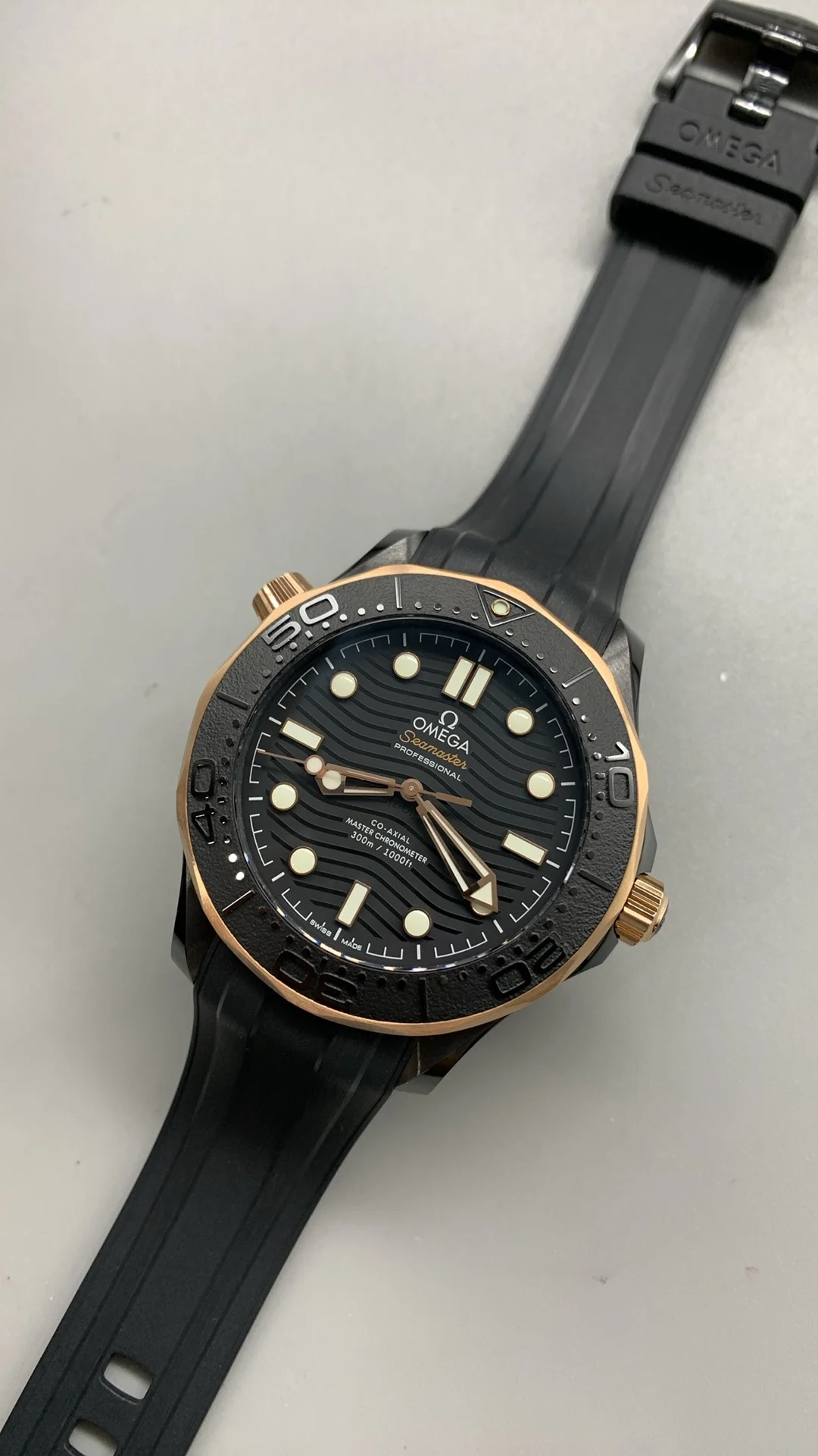Omega Seamaster 300 Rose Gold Black Dial — photographed off the sweep