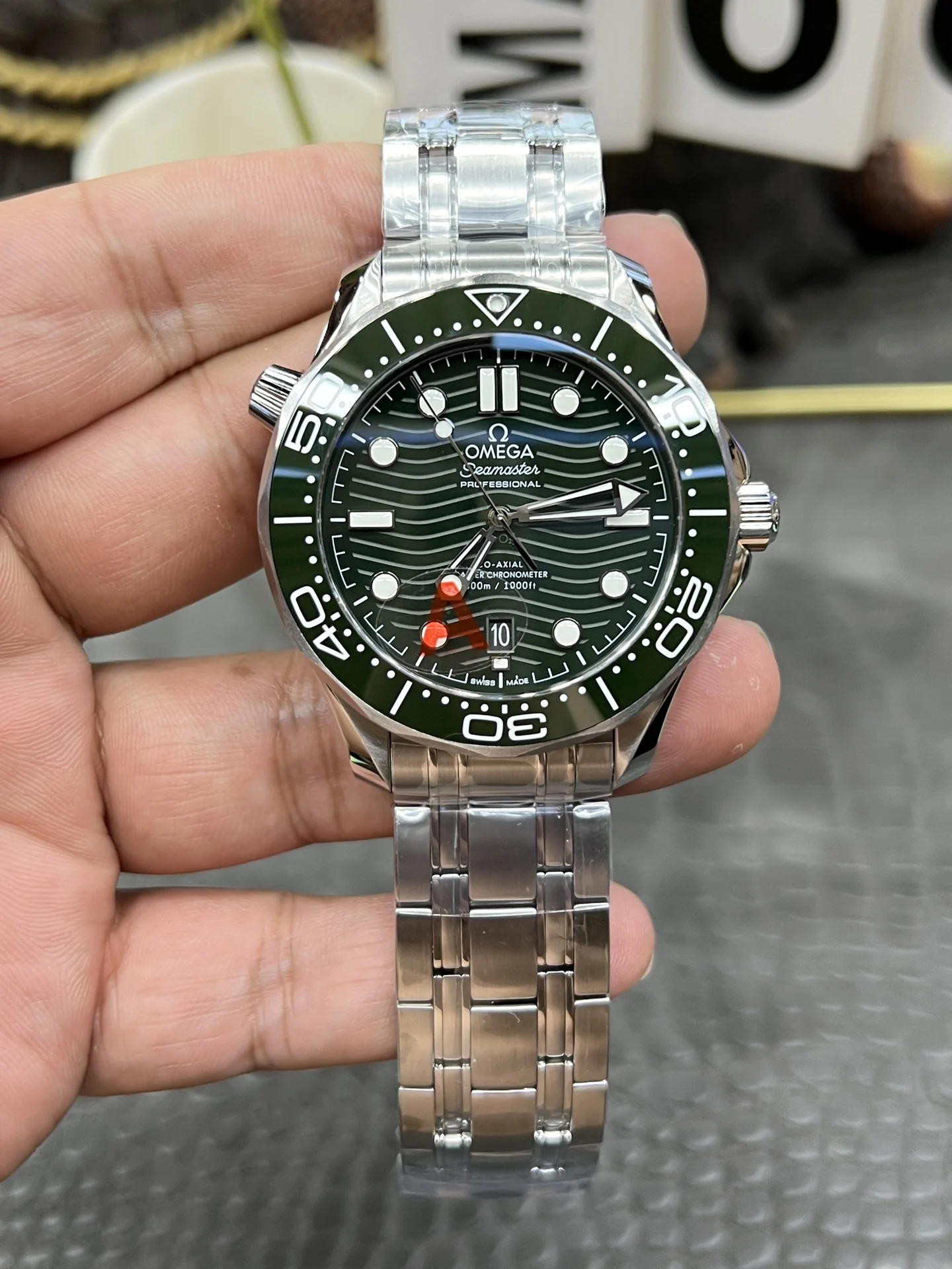 Omega Seamaster 300 Steel Green Dial — photographed off the sweep