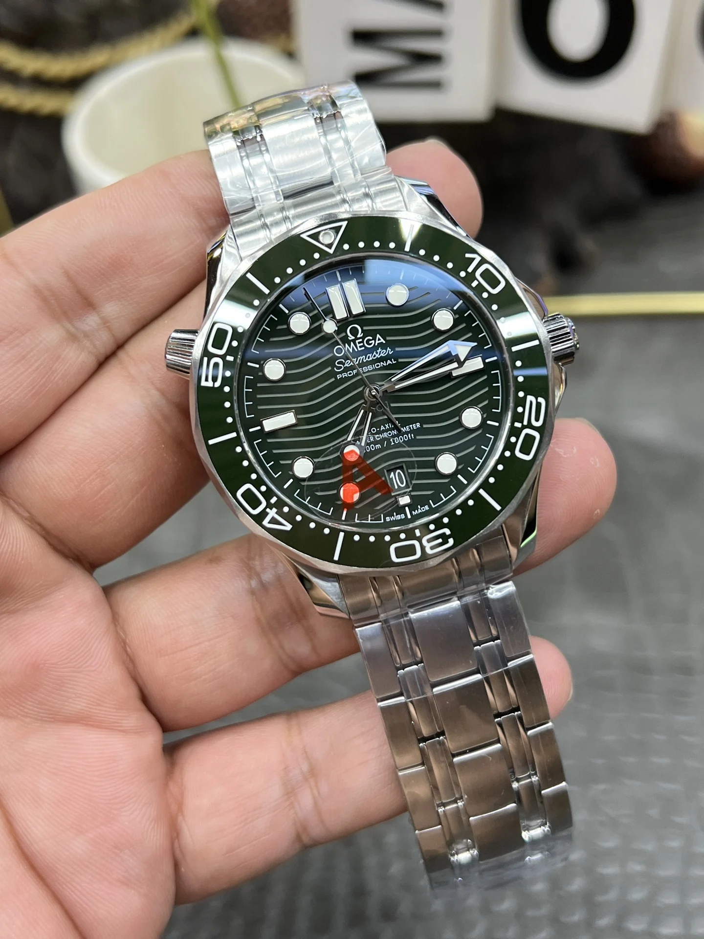 Omega Seamaster 300 Steel Green Dial — photographed off the sweep