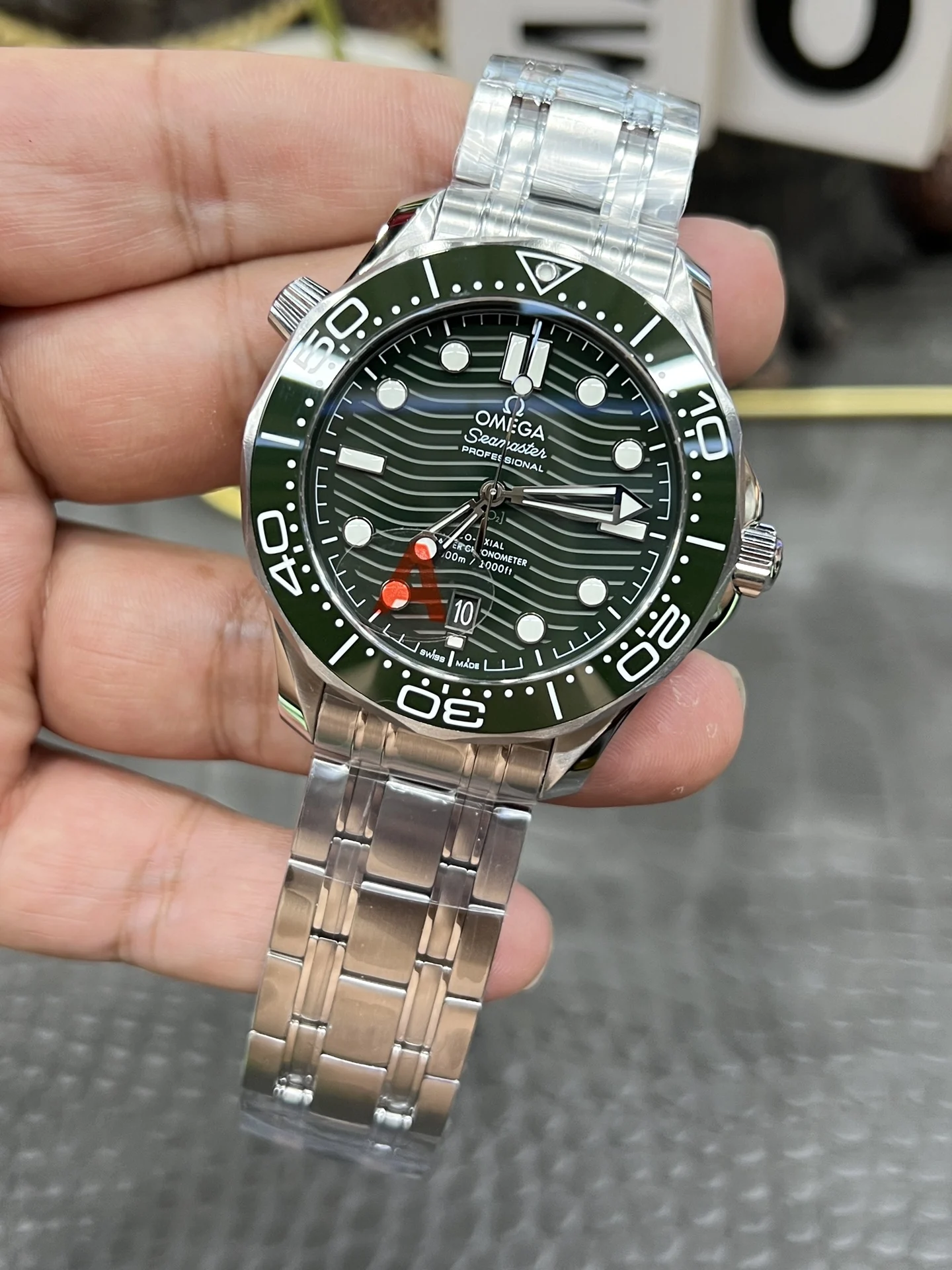Omega Seamaster 300 Steel Green Dial — photographed off the sweep