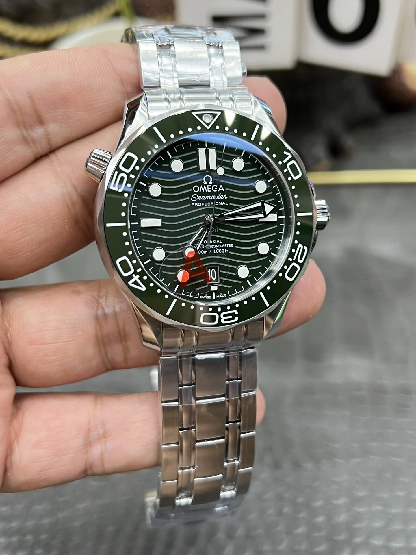 Omega Seamaster 300 Steel Green Dial — photographed off the sweep