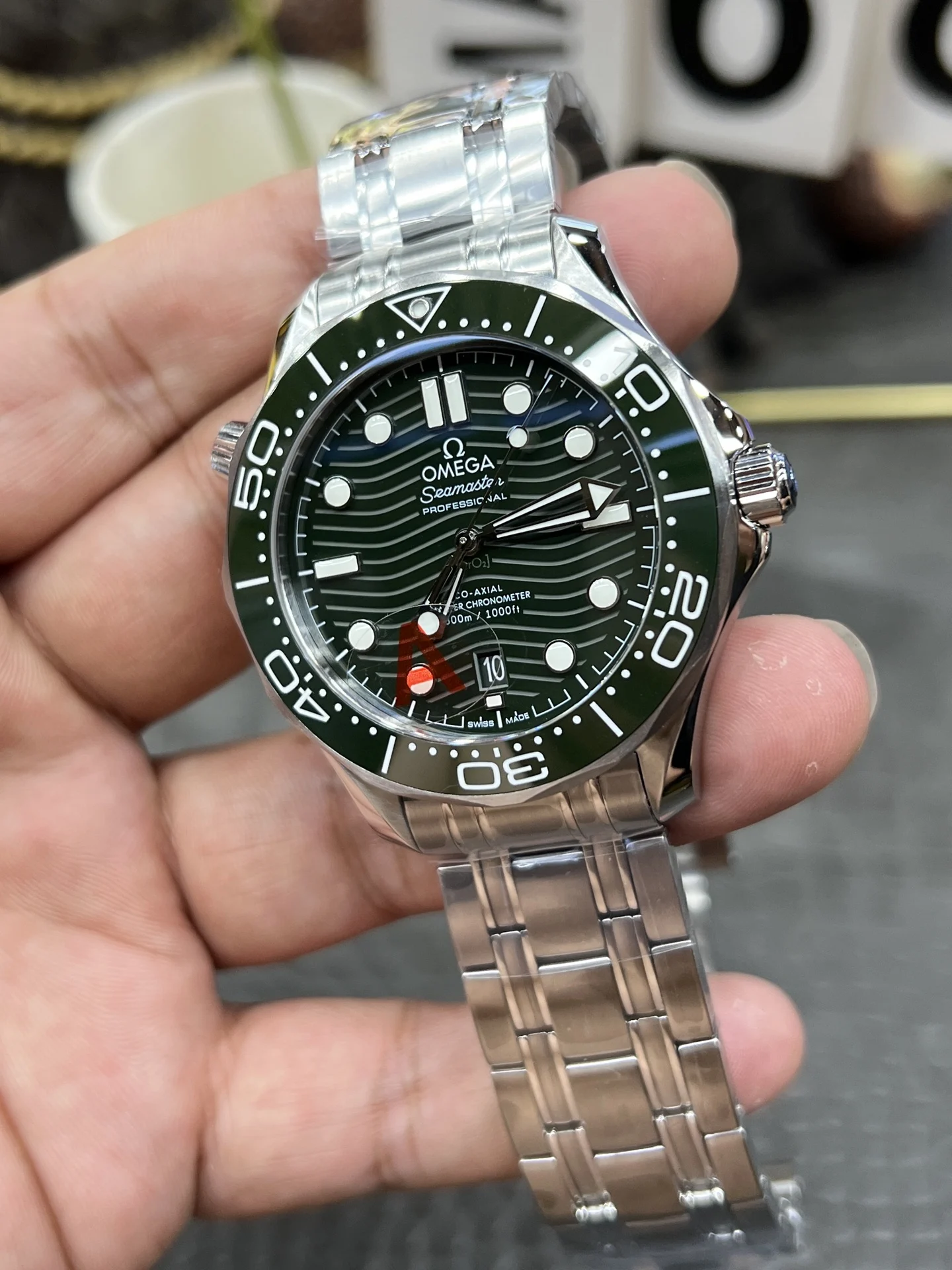 Omega Seamaster 300 Steel Green Dial — photographed off the sweep