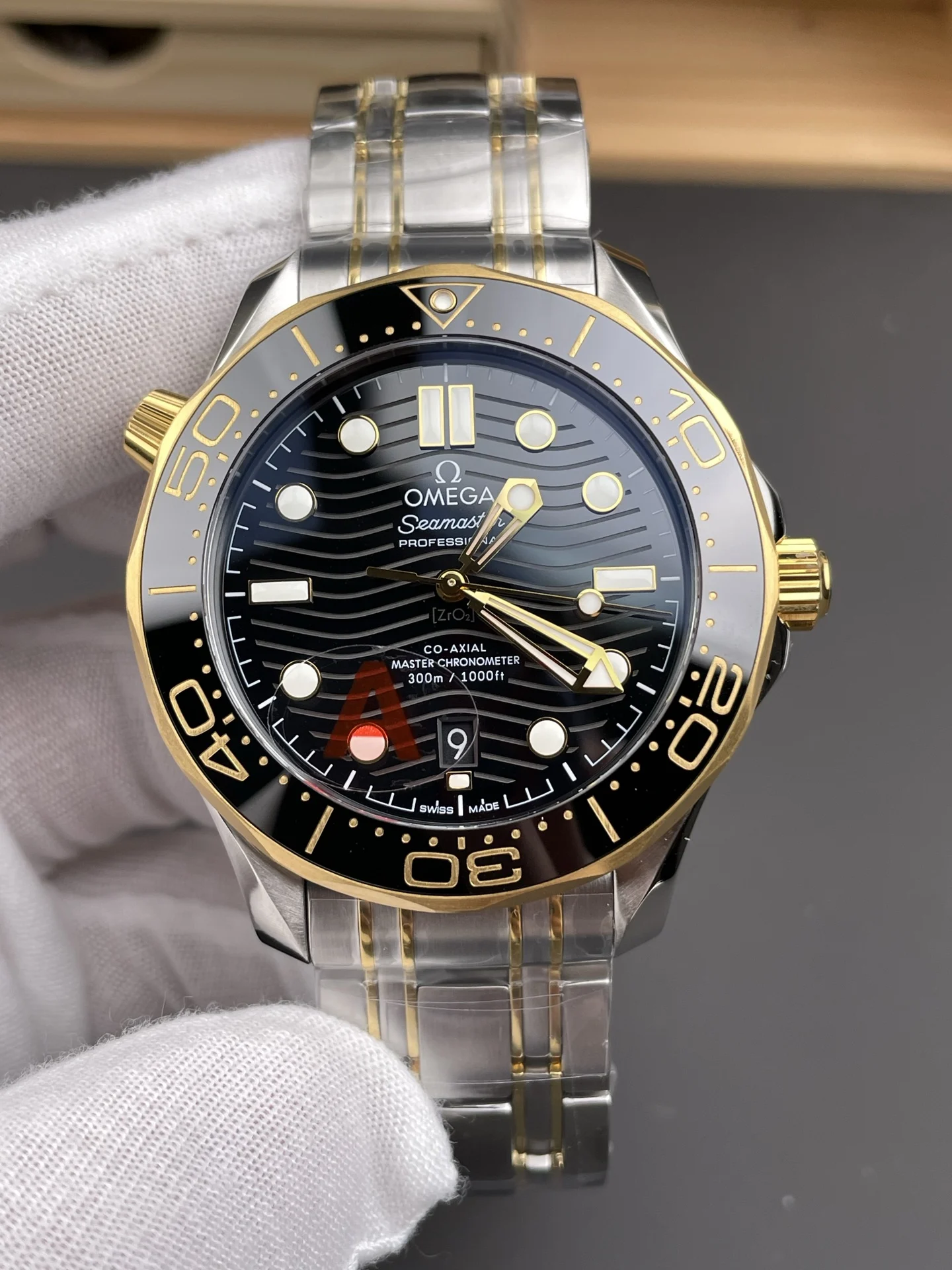 Omega Seamaster 300 Two-Tone Black Dial 42mm — photographed off the sweep