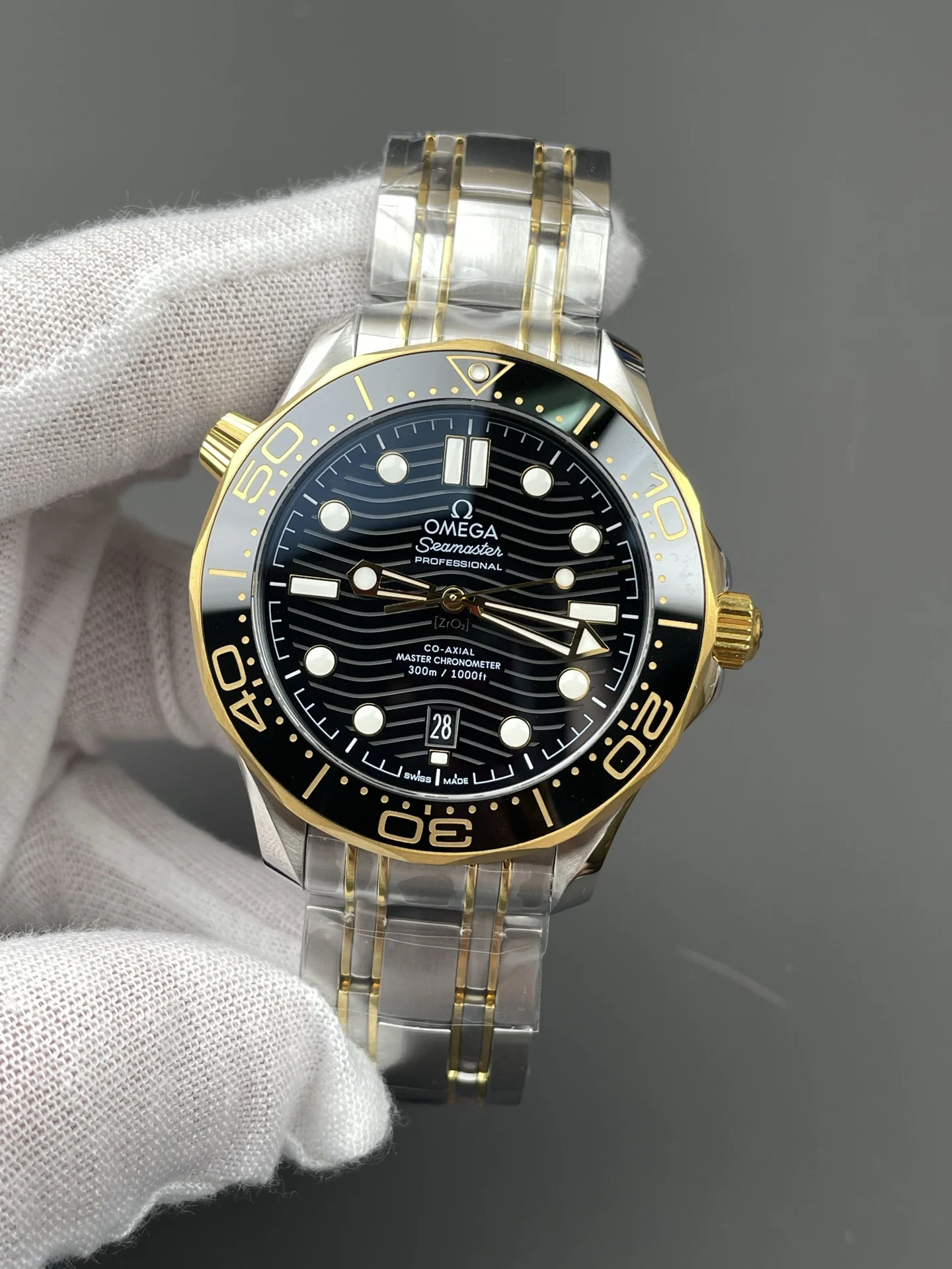 Omega Seamaster 300 Two-Tone Black Dial 42mm — photographed off the sweep