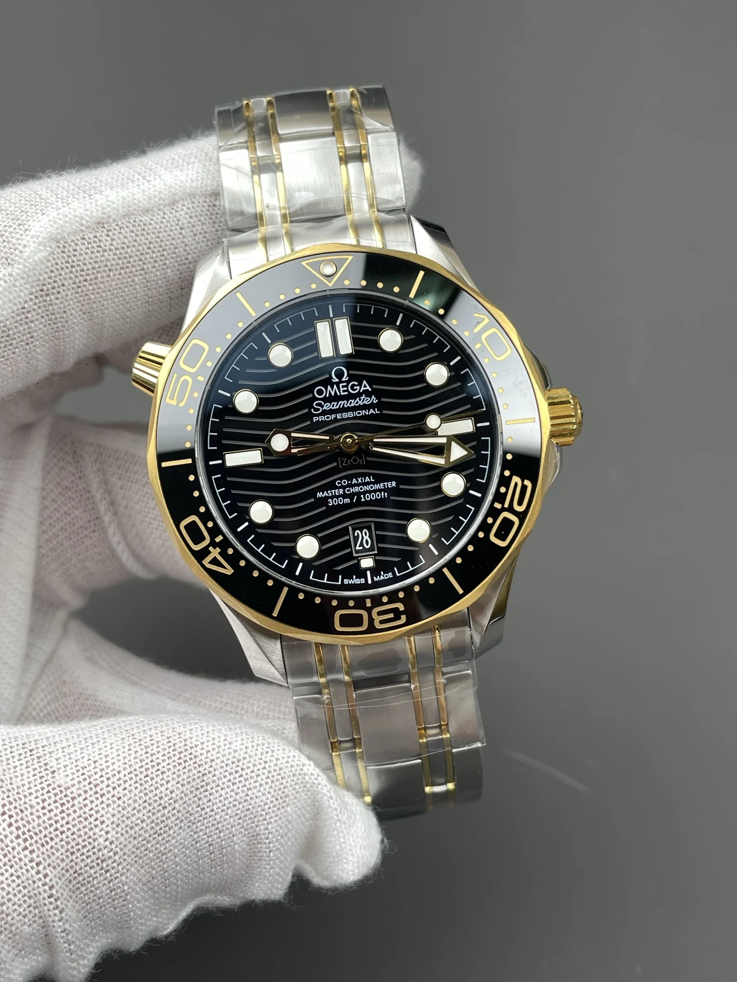 Omega Seamaster 300 Two-Tone Black Dial 42mm — photographed off the sweep