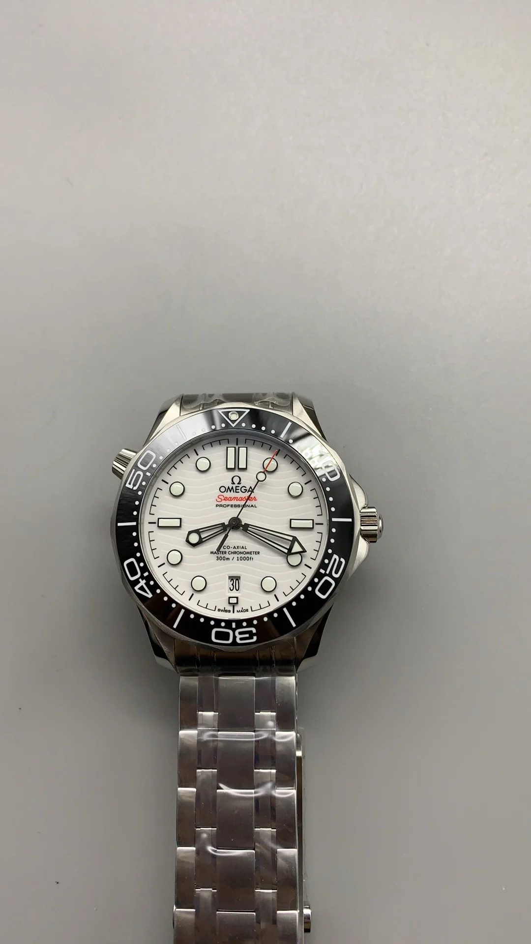 Omega Seamaster 300 White Dial — photographed off the sweep