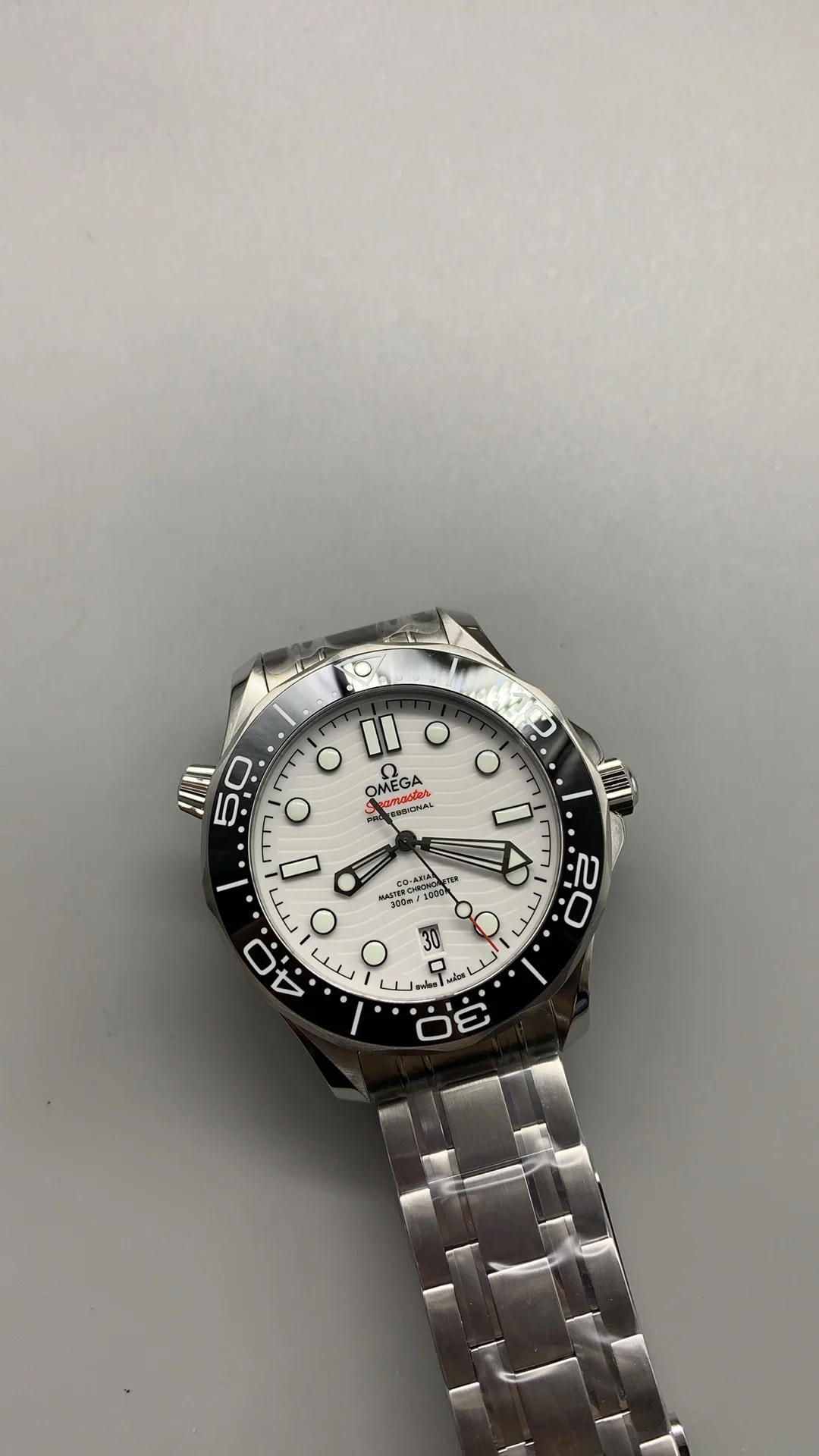 Omega Seamaster 300 White Dial — photographed off the sweep