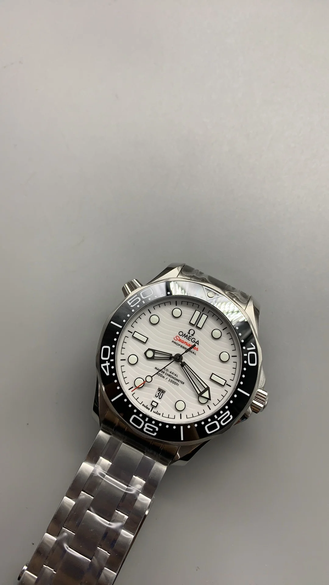 Omega Seamaster 300 White Dial — photographed off the sweep