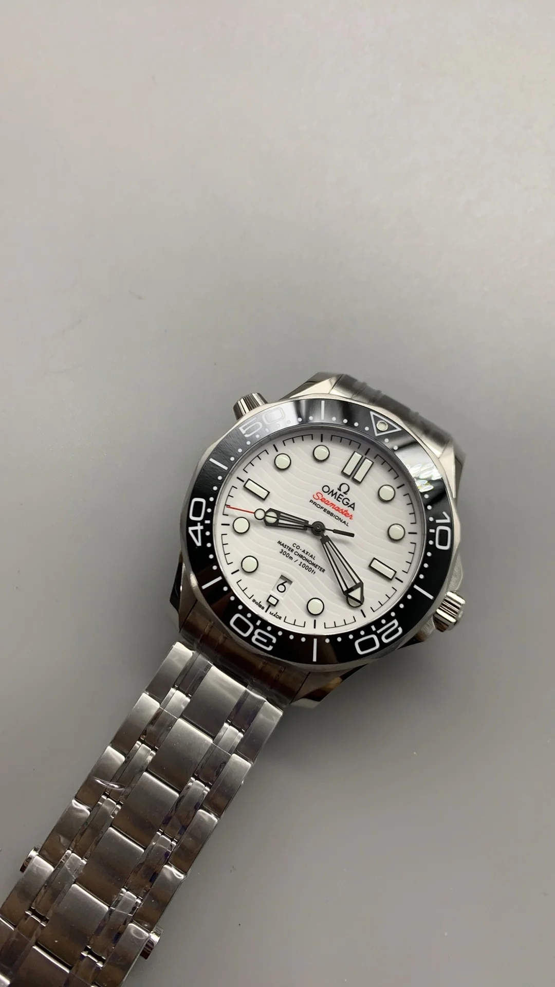 Omega Seamaster 300 White Dial — photographed off the sweep