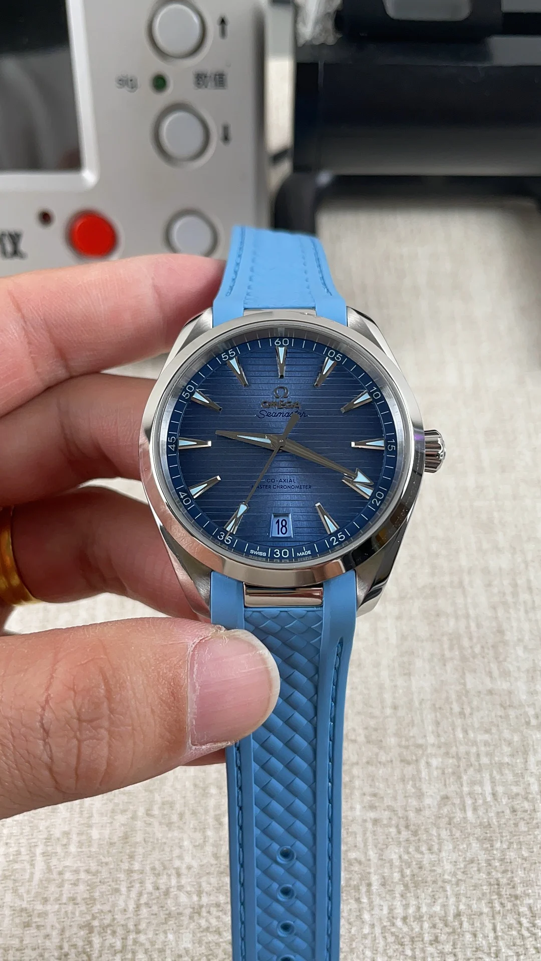 Omega Seamaster Aqua Terra Ice Blue Blue Dial — photographed off the sweep