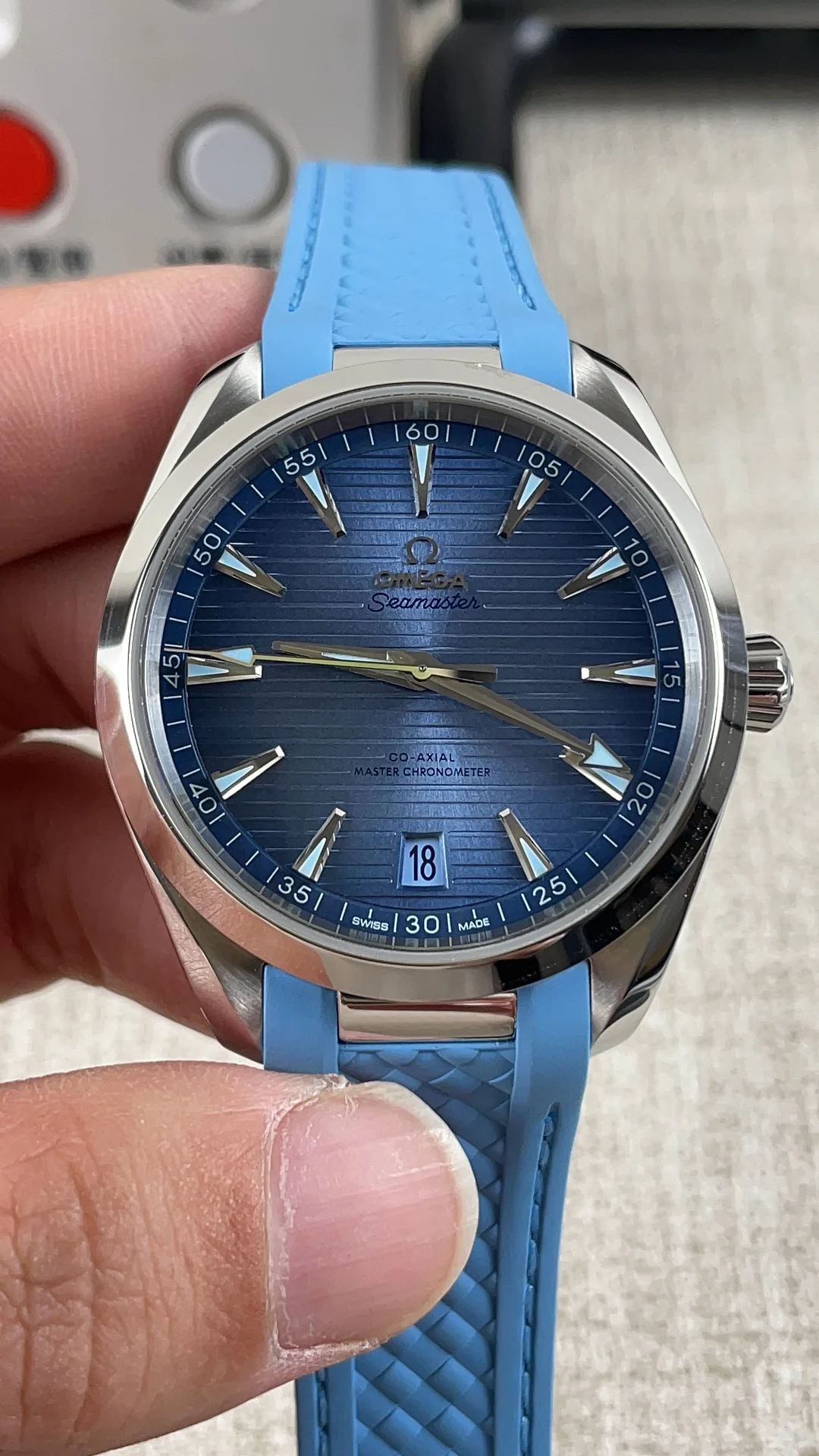 Omega Seamaster Aqua Terra Ice Blue Blue Dial — photographed off the sweep