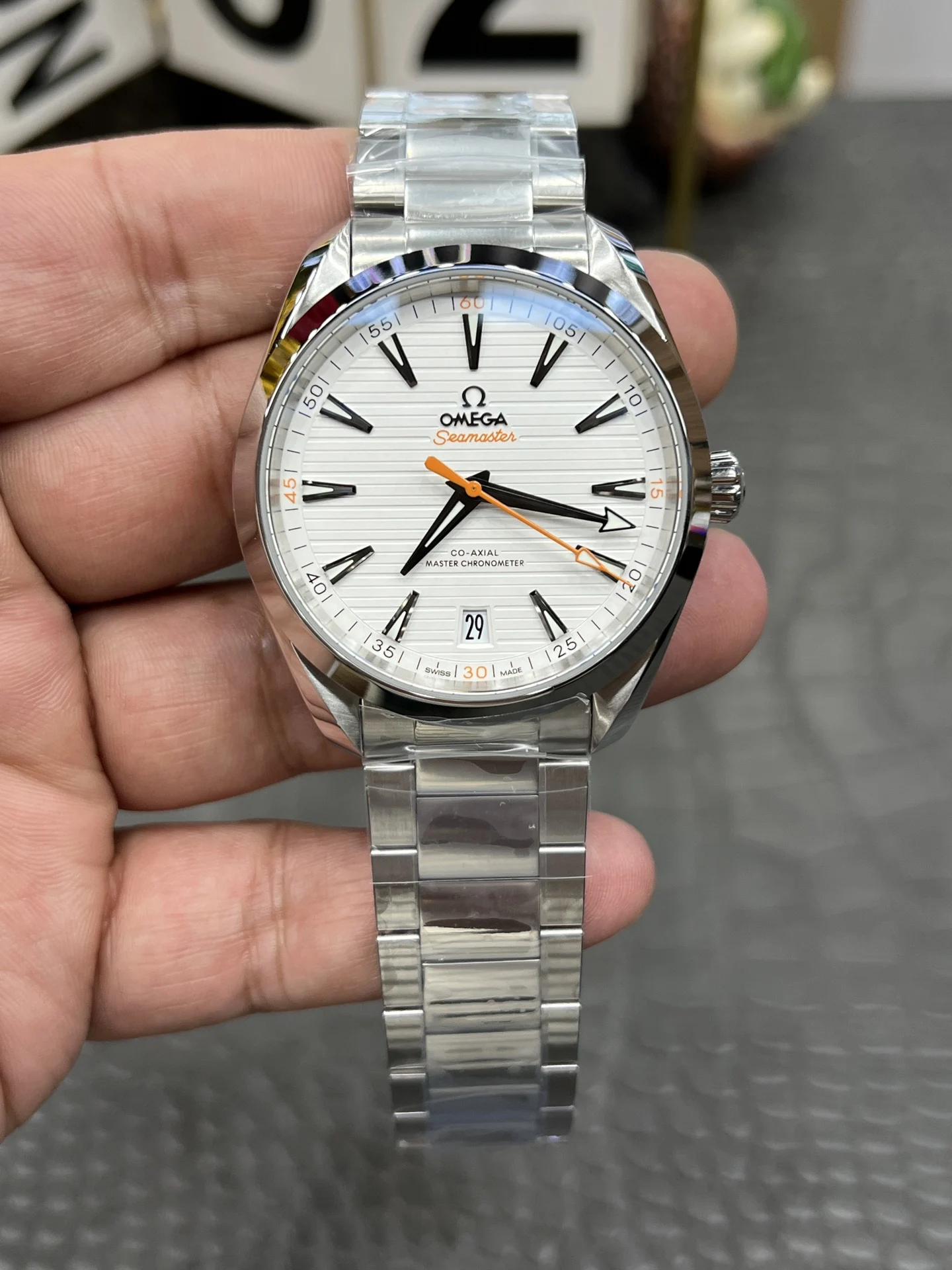 Omega Seamaster Aqua Terra Orange Dial 41.5mm — photographed off the sweep