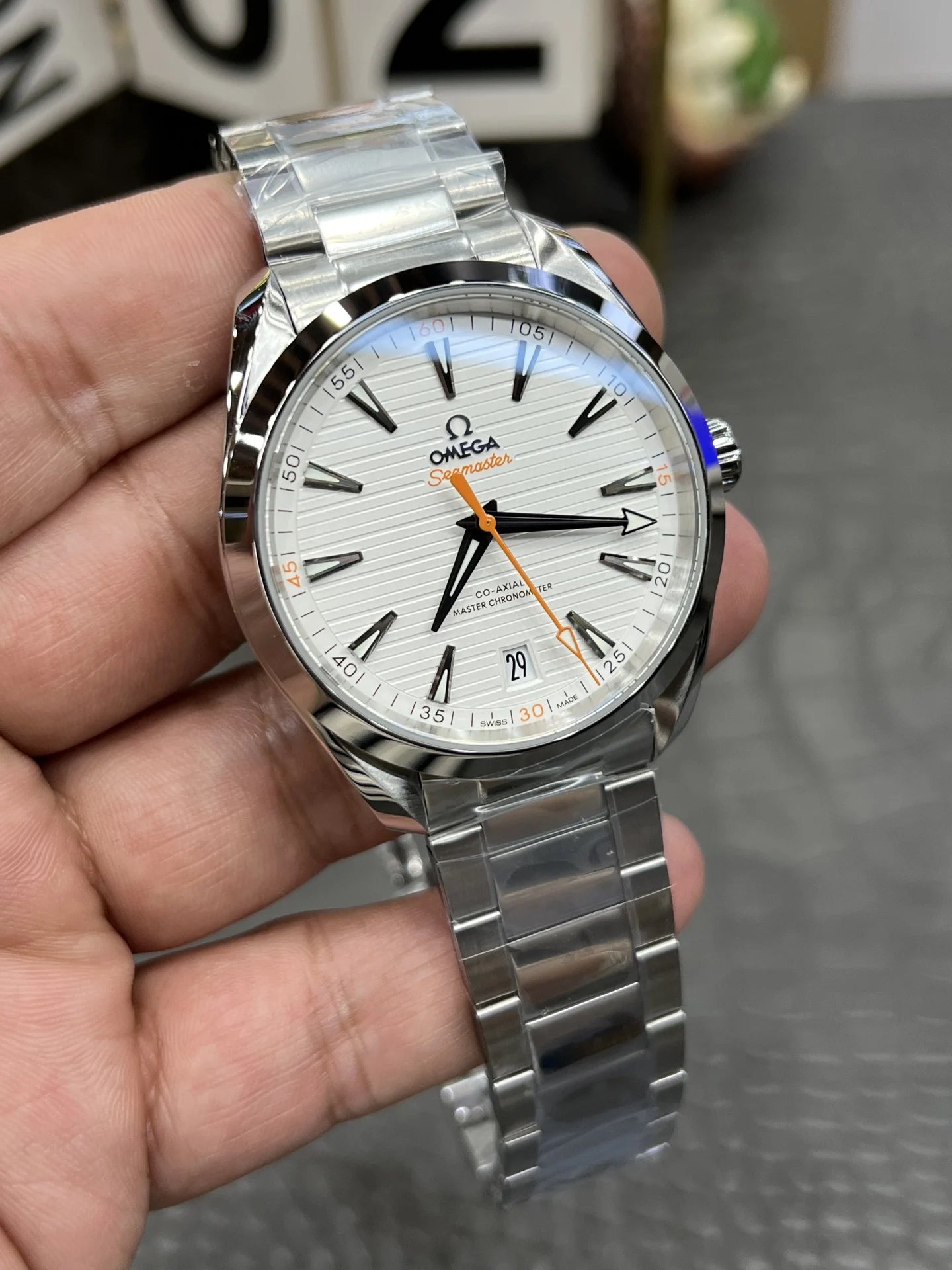 Omega Seamaster Aqua Terra Orange Dial 41.5mm — photographed off the sweep