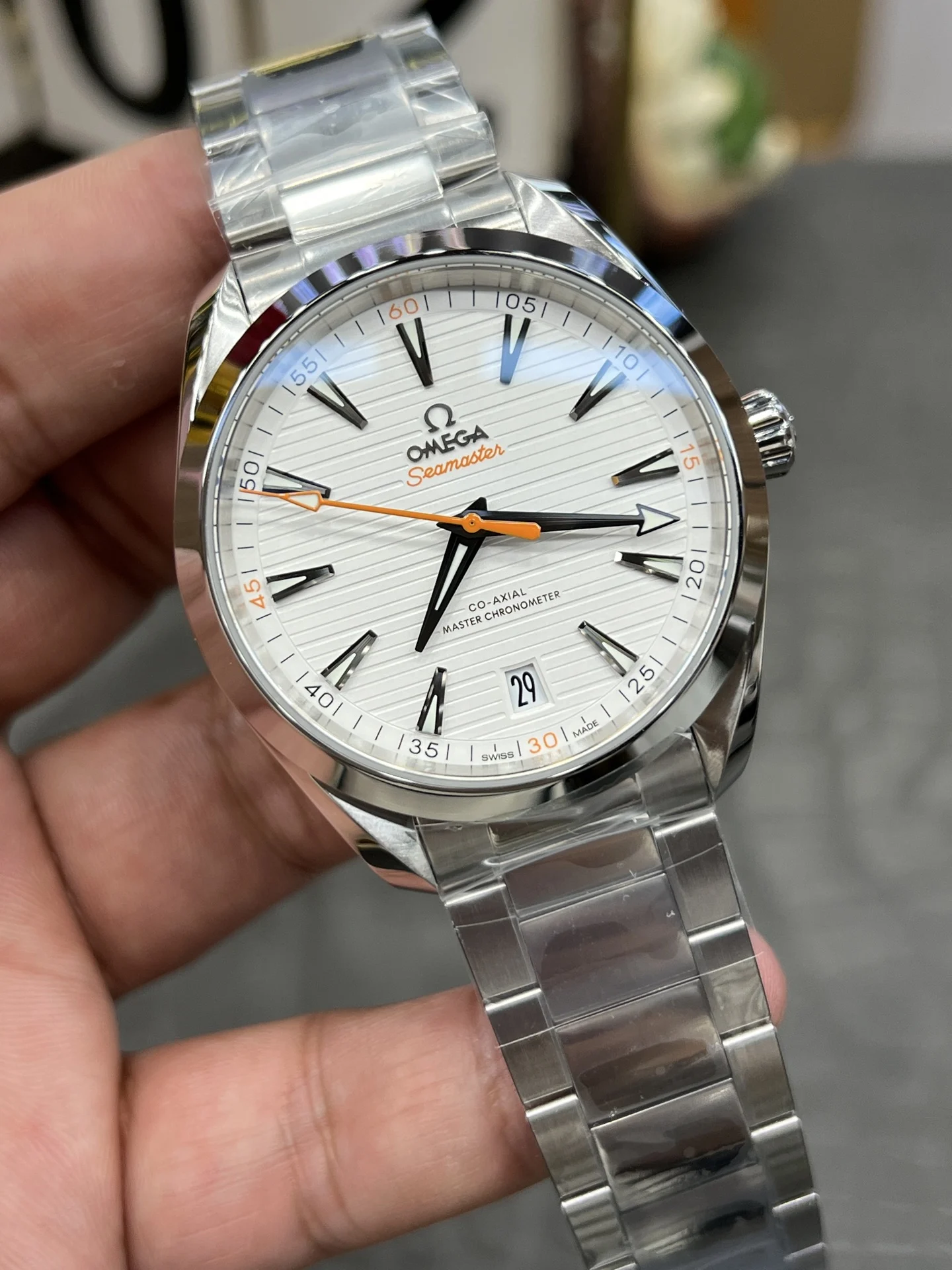 Omega Seamaster Aqua Terra Orange Dial 41.5mm — photographed off the sweep