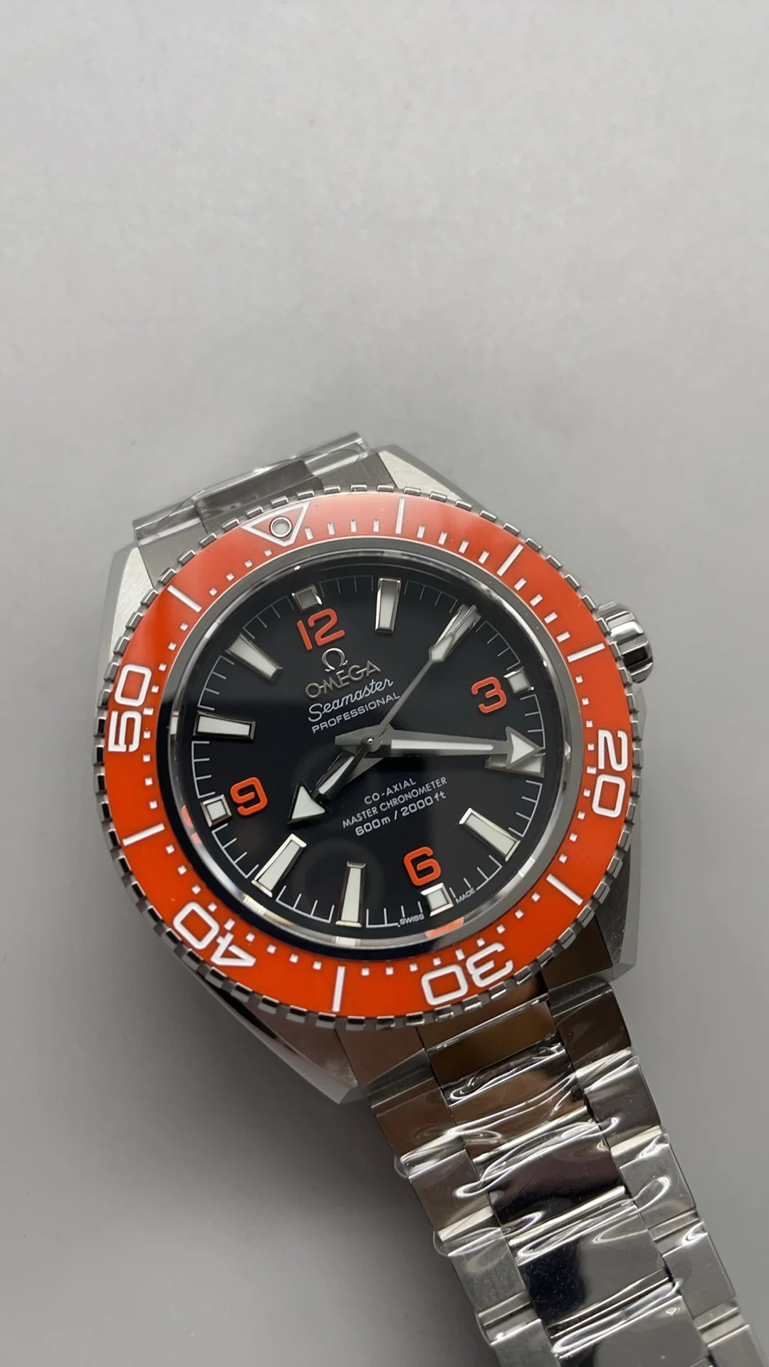 Omega Seamaster Orange Dial 42mm — photographed off the sweep