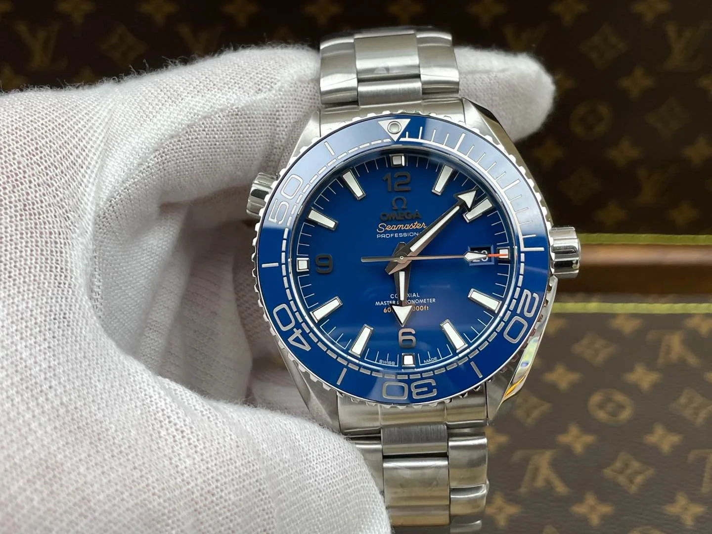 Omega Seamaster Planet Ocean Ceramic Blue Dial — photographed off the sweep