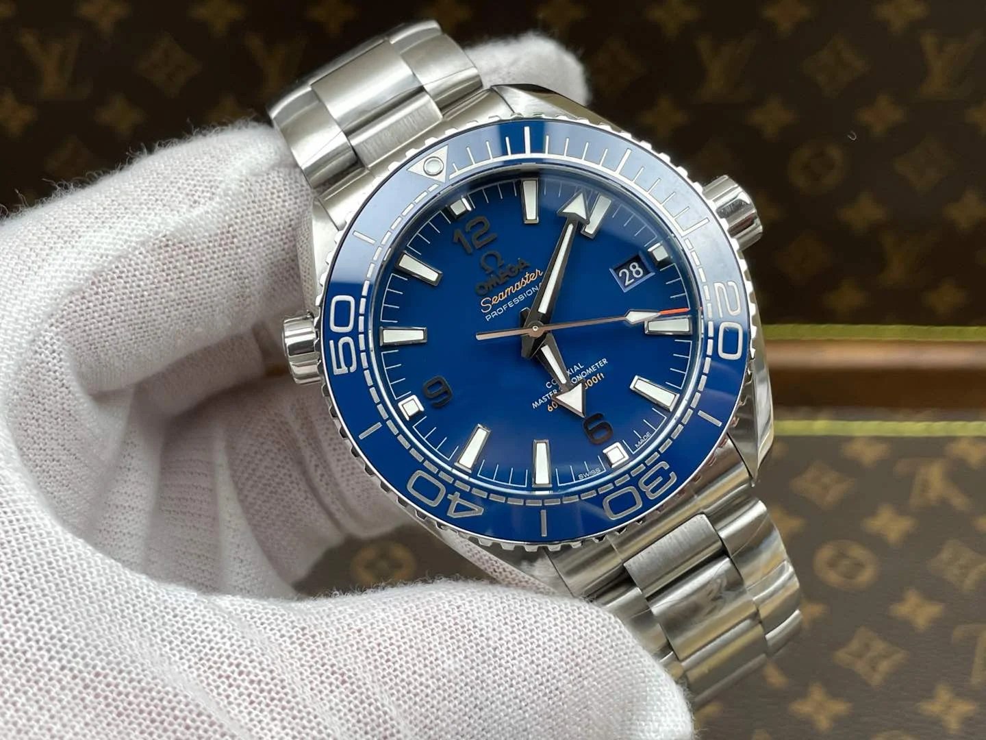 Omega Seamaster Planet Ocean Ceramic Blue Dial — photographed off the sweep