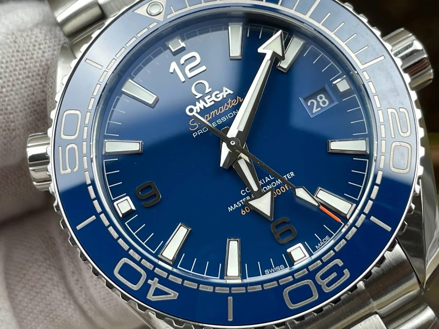 Omega Seamaster Planet Ocean Ceramic Blue Dial — photographed off the sweep