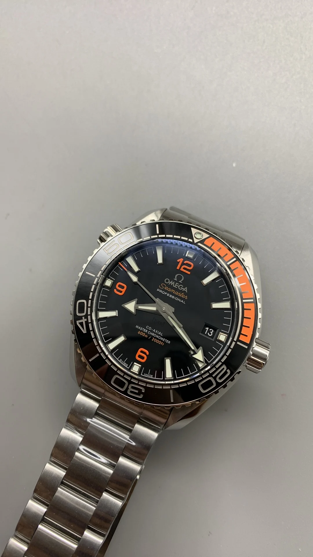 Omega Seamaster Planet Ocean Orange Dial — photographed off the sweep