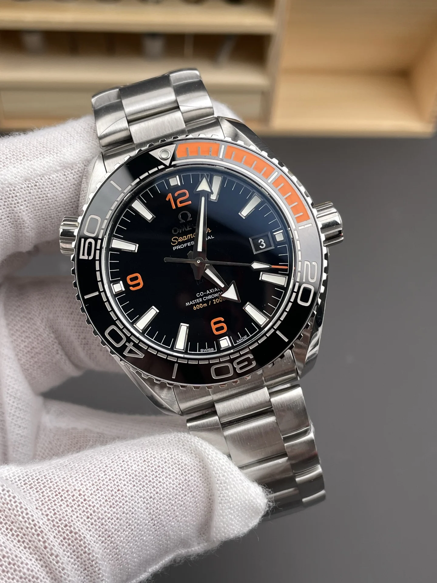 Omega Seamaster Planet Ocean Orange Dial 43.5mm — photographed off the sweep