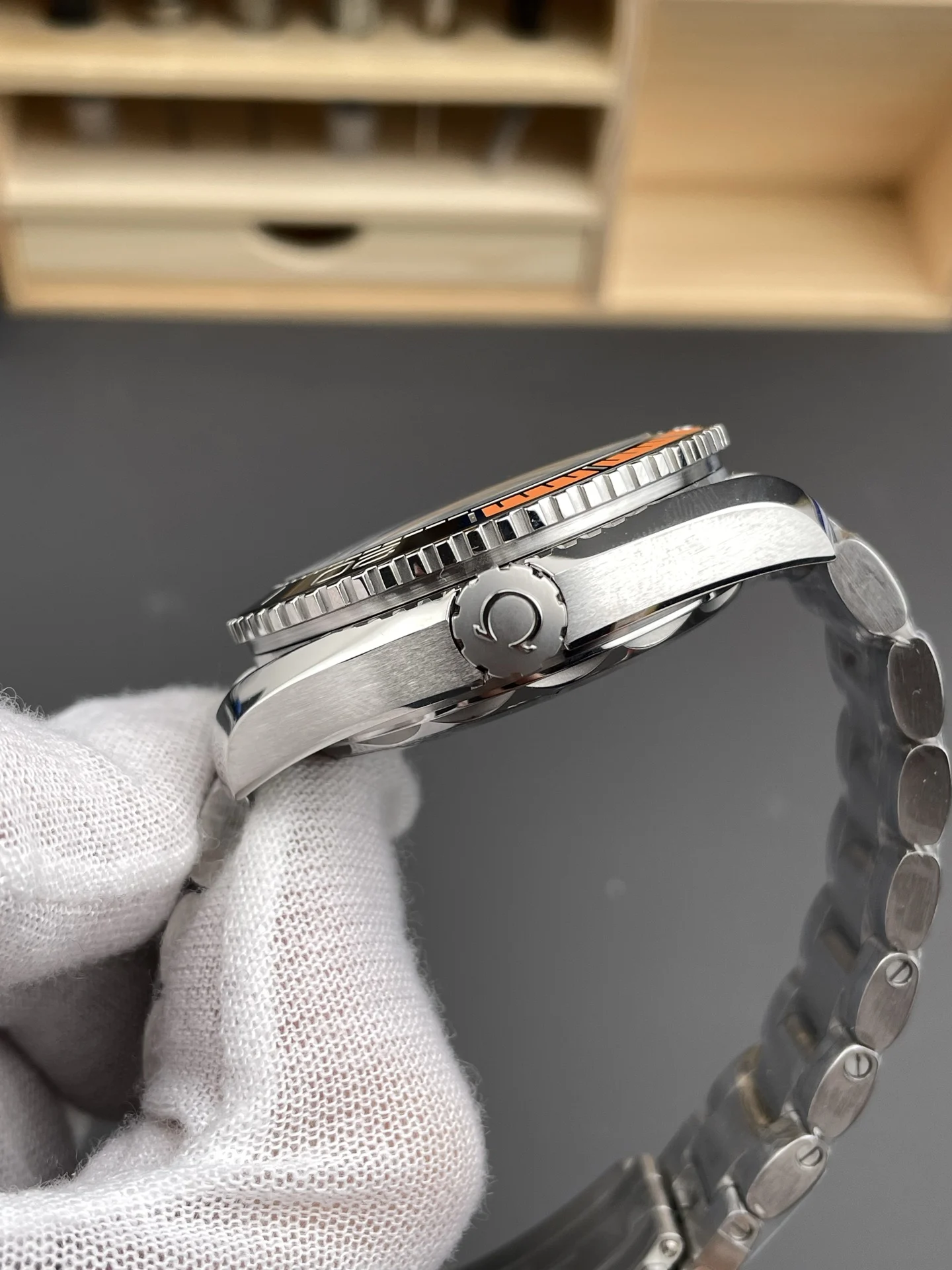 Omega Seamaster Planet Ocean Orange Dial 43.5mm — photographed off the sweep