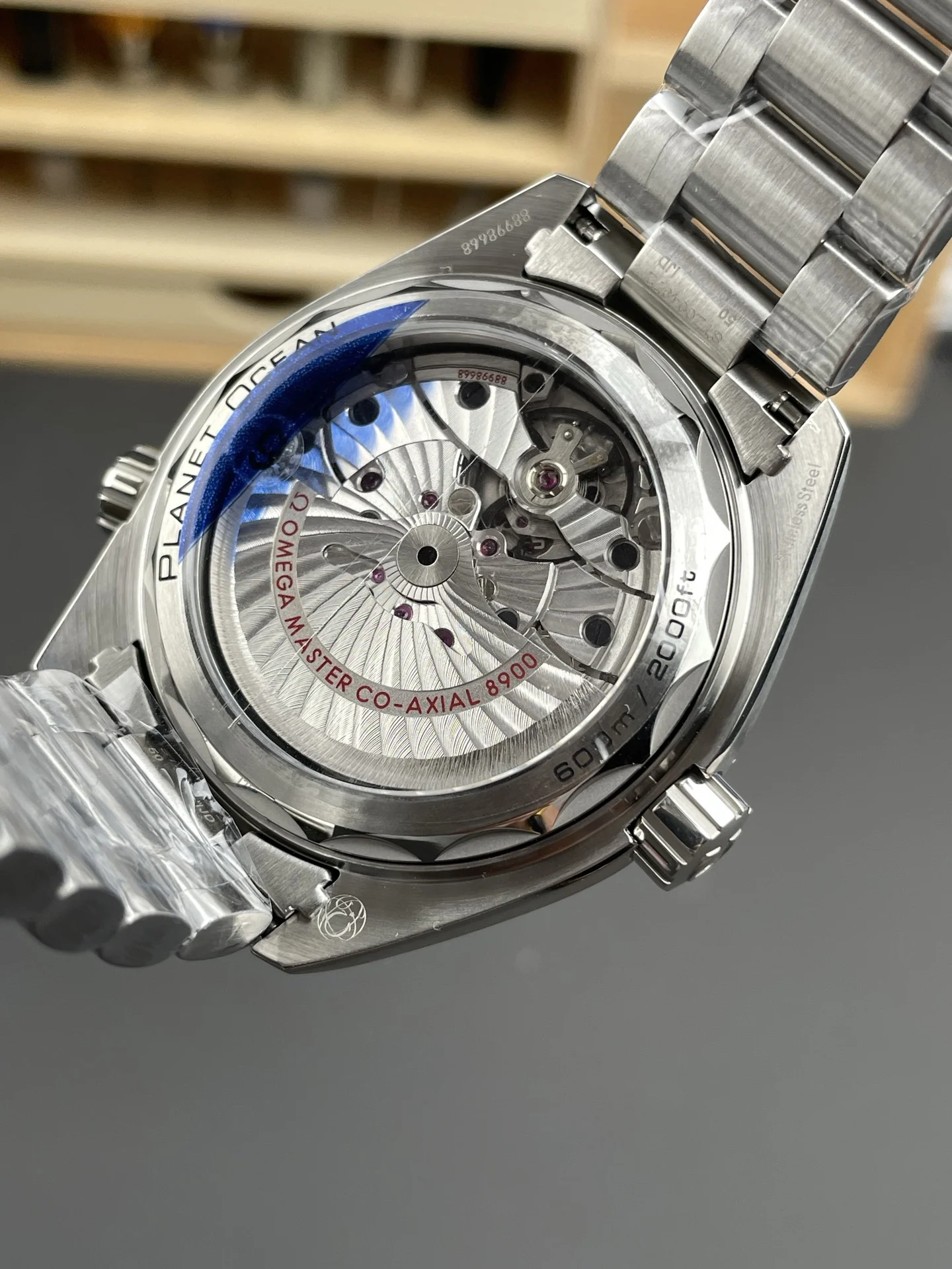 Omega Seamaster Planet Ocean Orange Dial 43.5mm — photographed off the sweep