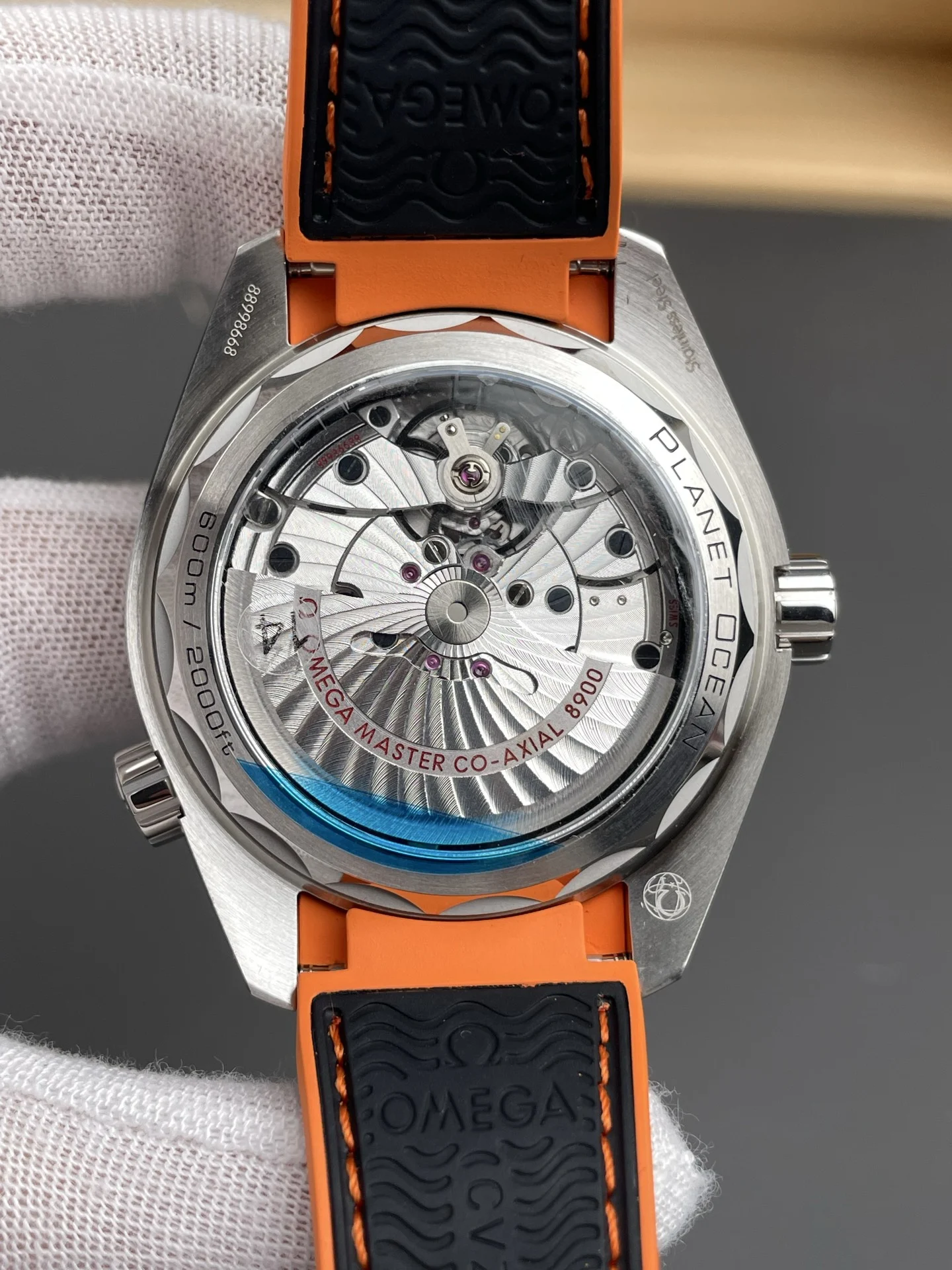 Omega Seamaster Planet Ocean Orange Dial 43.5mm — photographed off the sweep