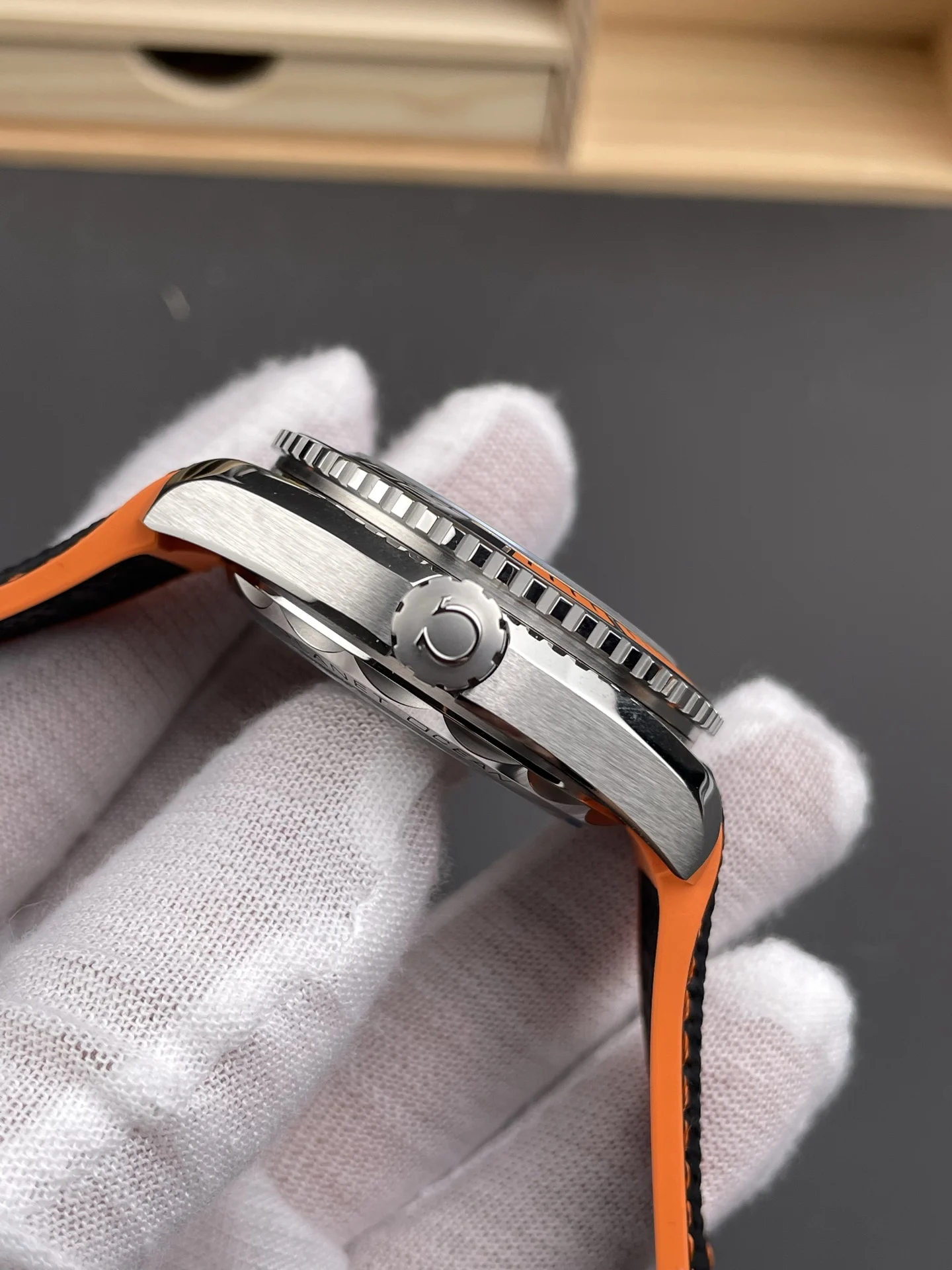 Omega Seamaster Planet Ocean Orange Dial 43.5mm — photographed off the sweep