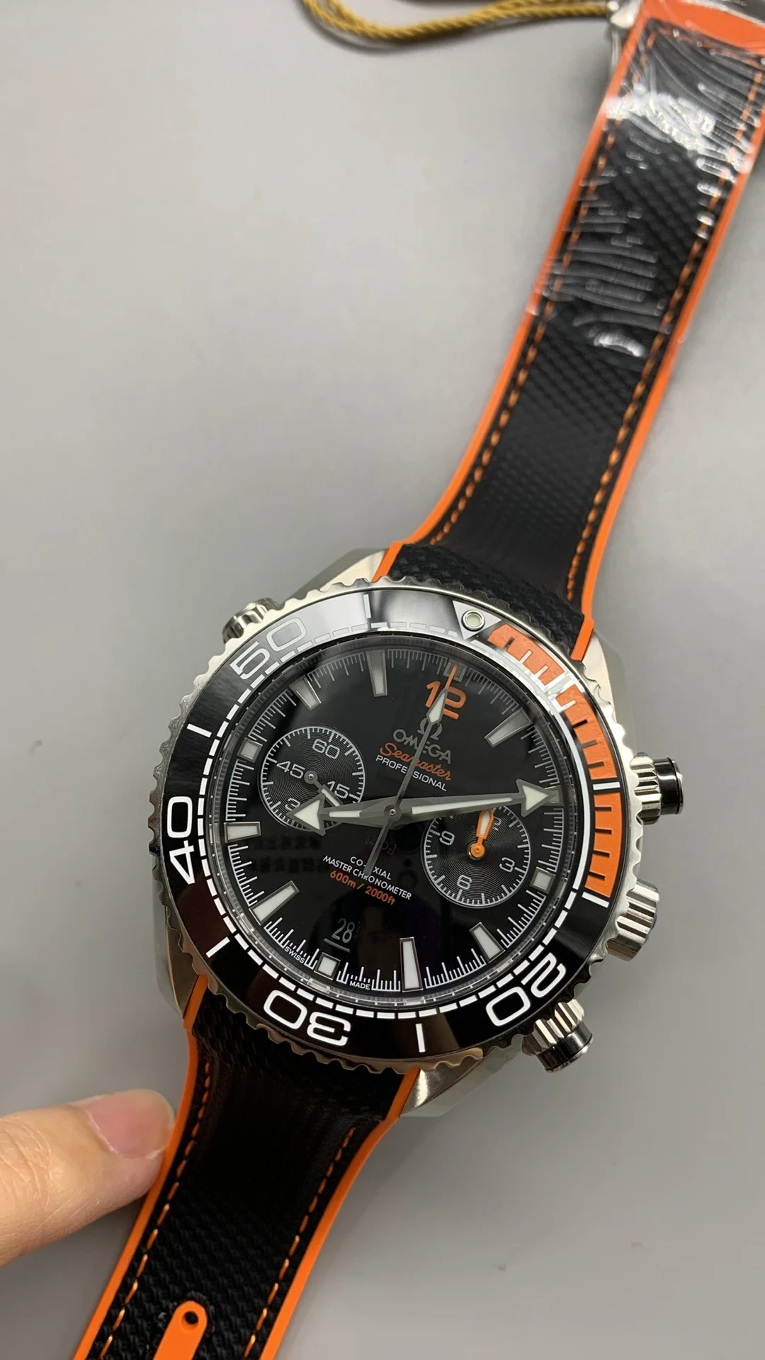 Omega Seamaster Planet Ocean Orange Dial — photographed off the sweep